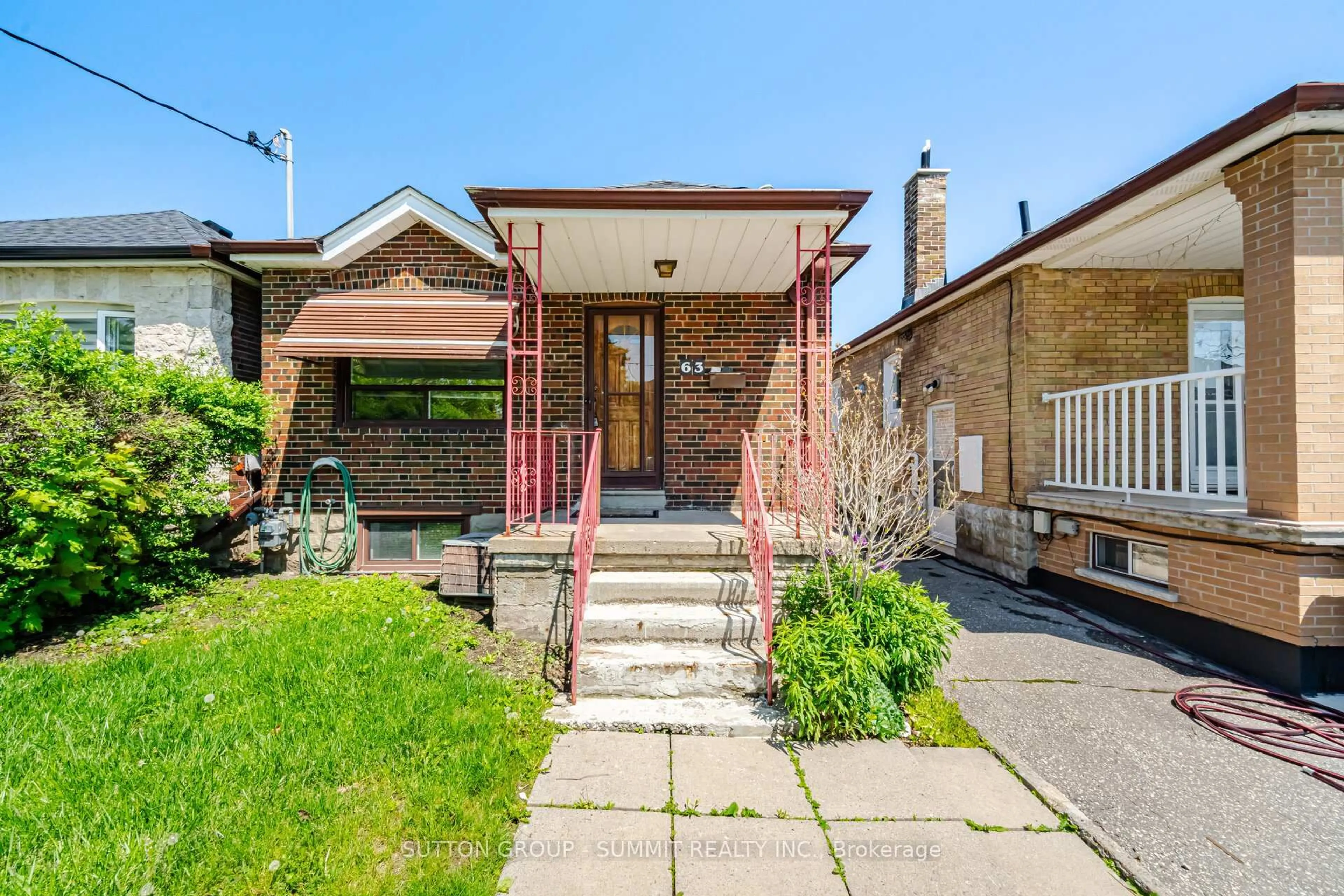 Home with brick exterior material, street for 63 Chamberlain Ave, Toronto Ontario M6E 4J9