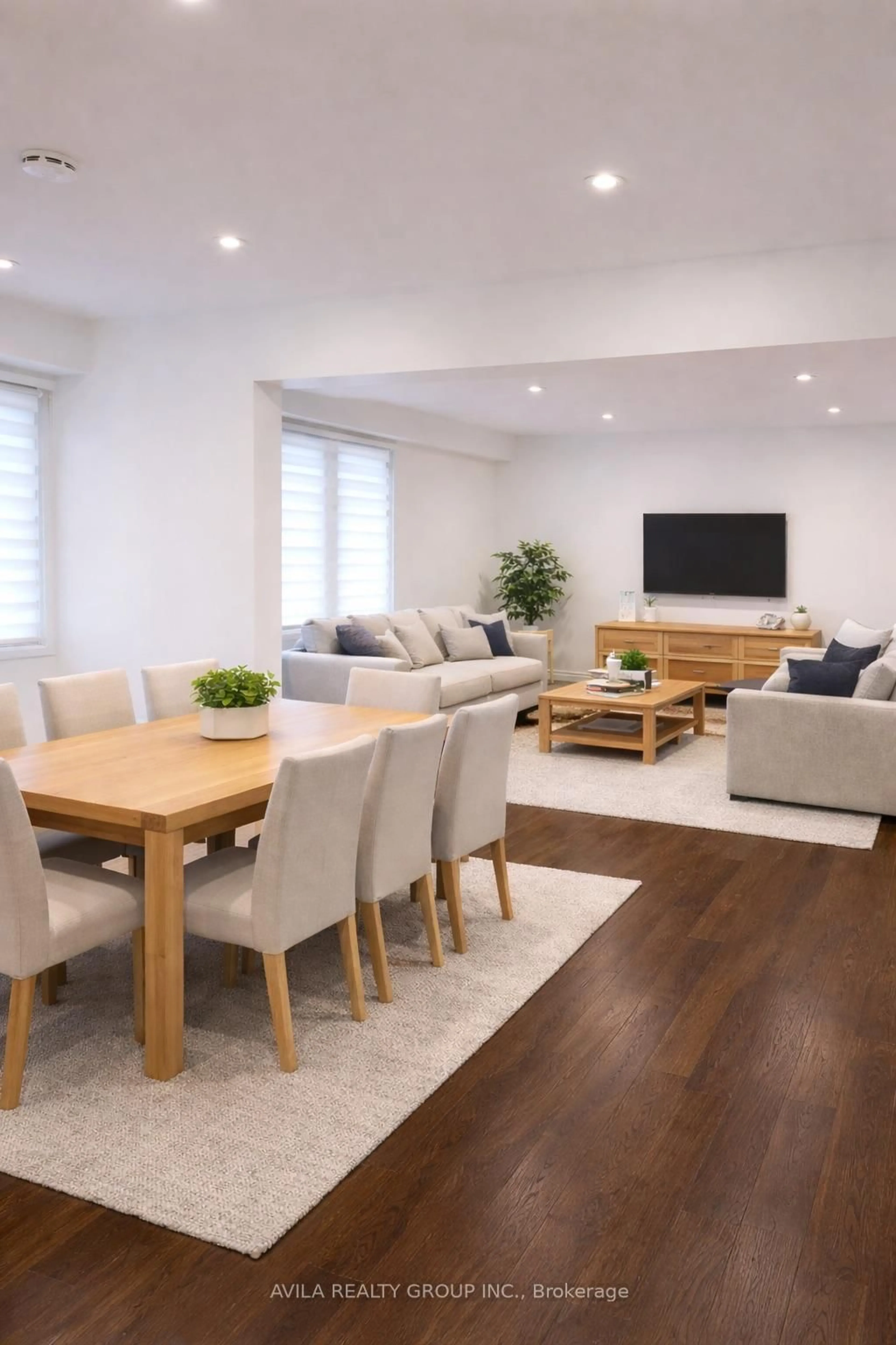 Living room with furniture, wood/laminate floor for 19 Habitat Sq, Brampton Ontario L6S 1X7