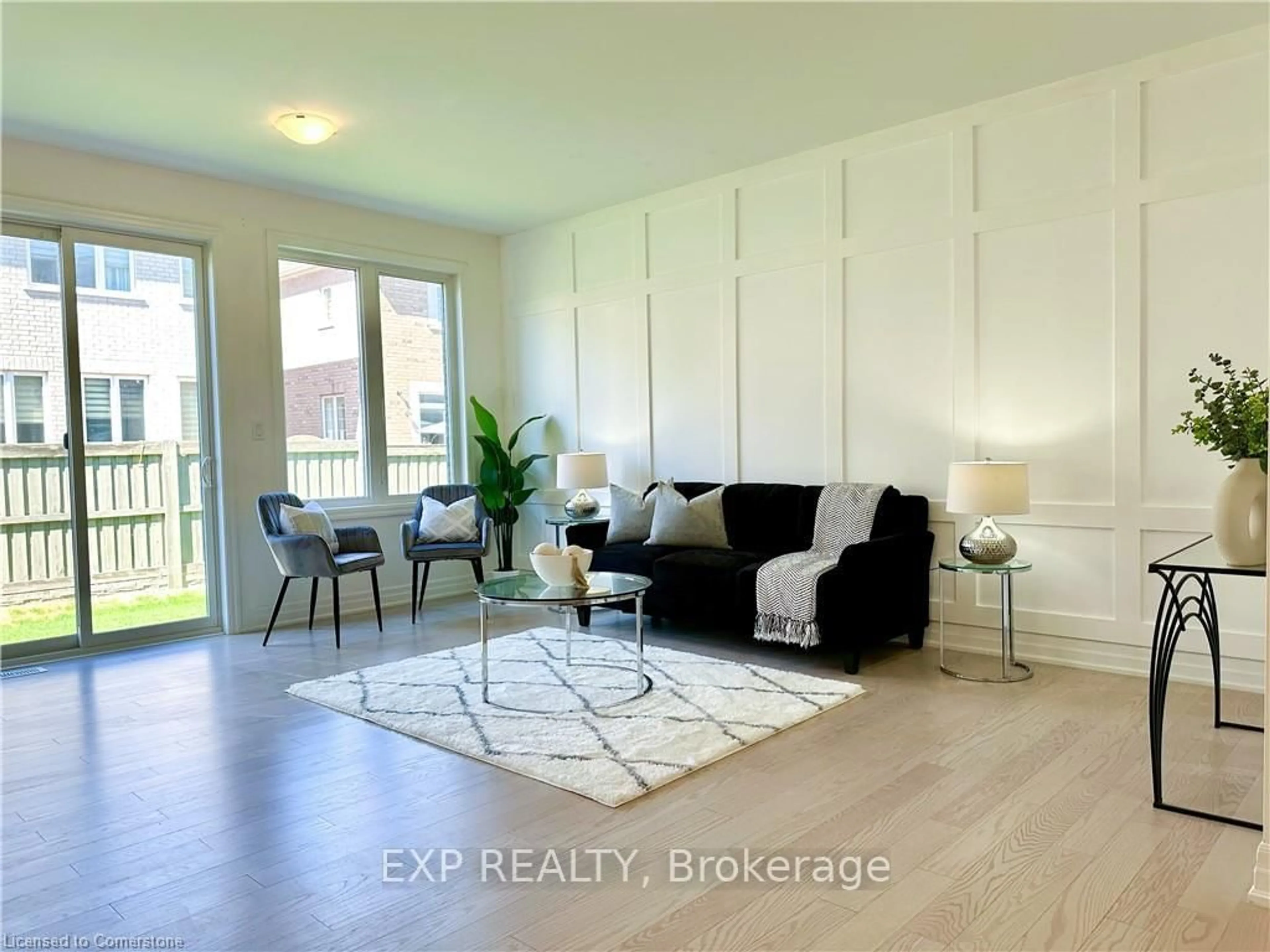 Living room with furniture, wood/laminate floor for 56 Keppel Circ, Brampton Ontario L7A 0B6