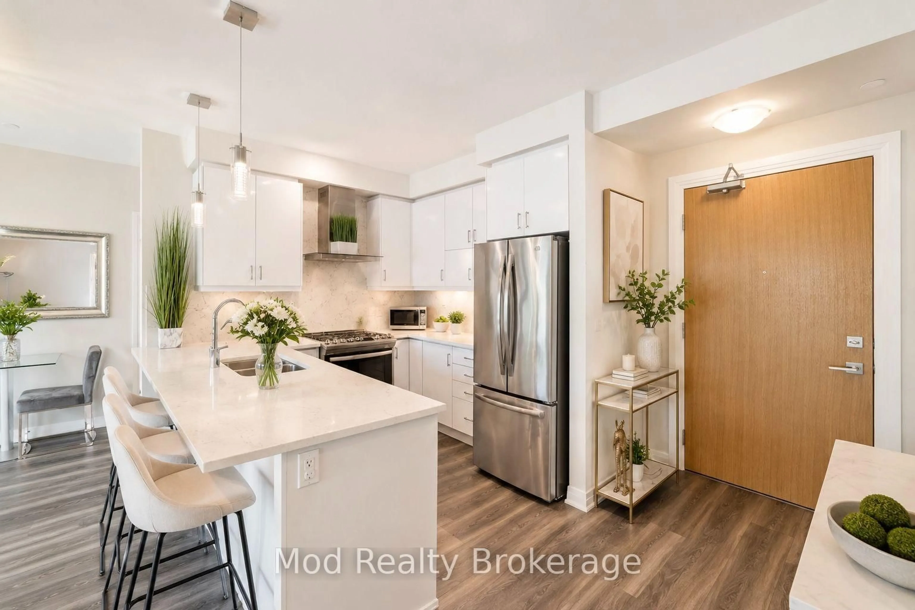 Open concept kitchen, wood/laminate floor for 128 Grovewood Common #129, Oakville Ontario L6H 0X3