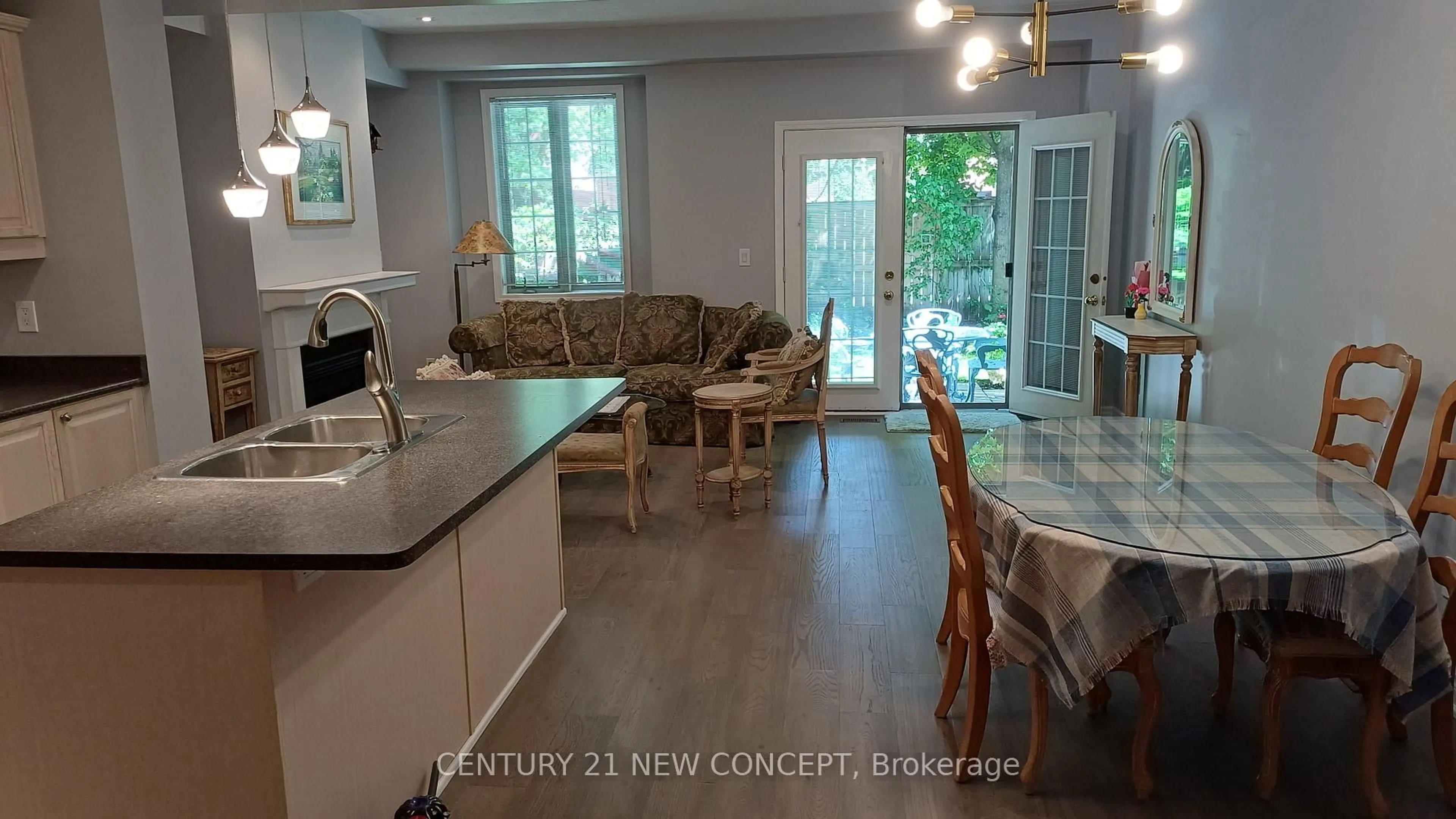 Open concept kitchen, wood/laminate floor for 2401 Fifth Line #8, Mississauga Ontario L5K 1V9
