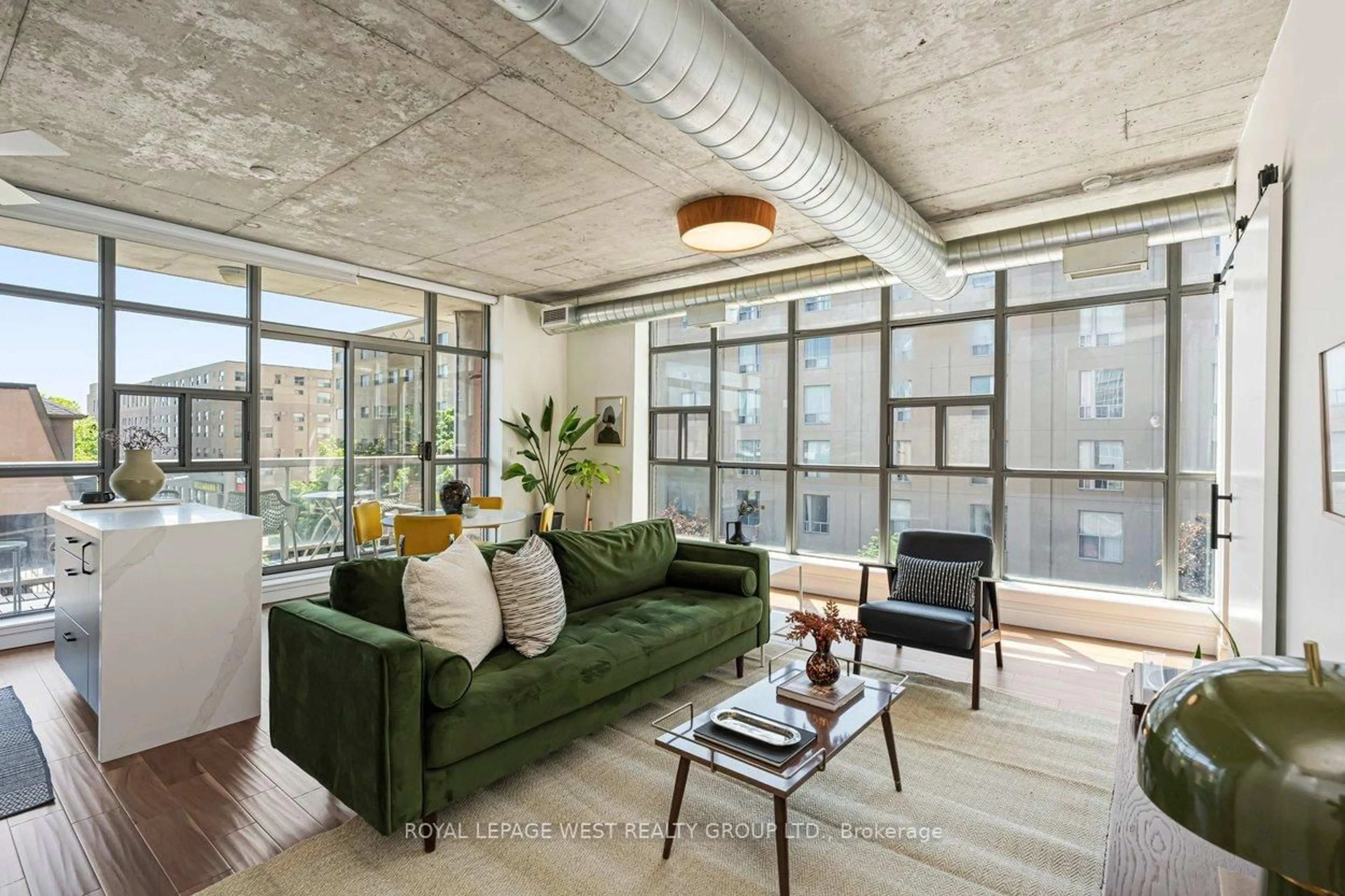 Living room with furniture, cement floor for 1375 Dupont St #406, Toronto Ontario M6H 4J8