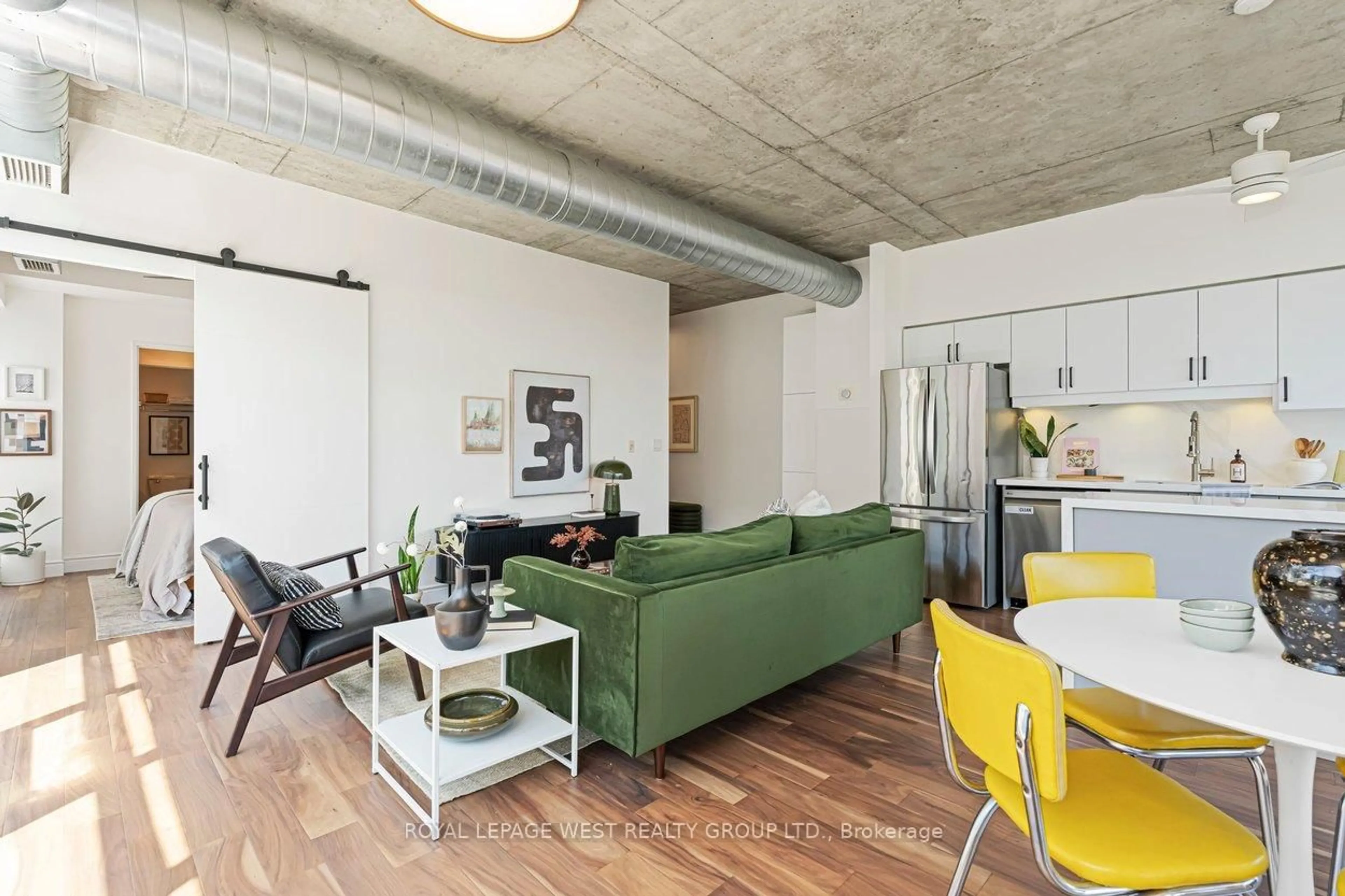Living room with furniture, cement floor for 1375 Dupont St #406, Toronto Ontario M6H 4J8