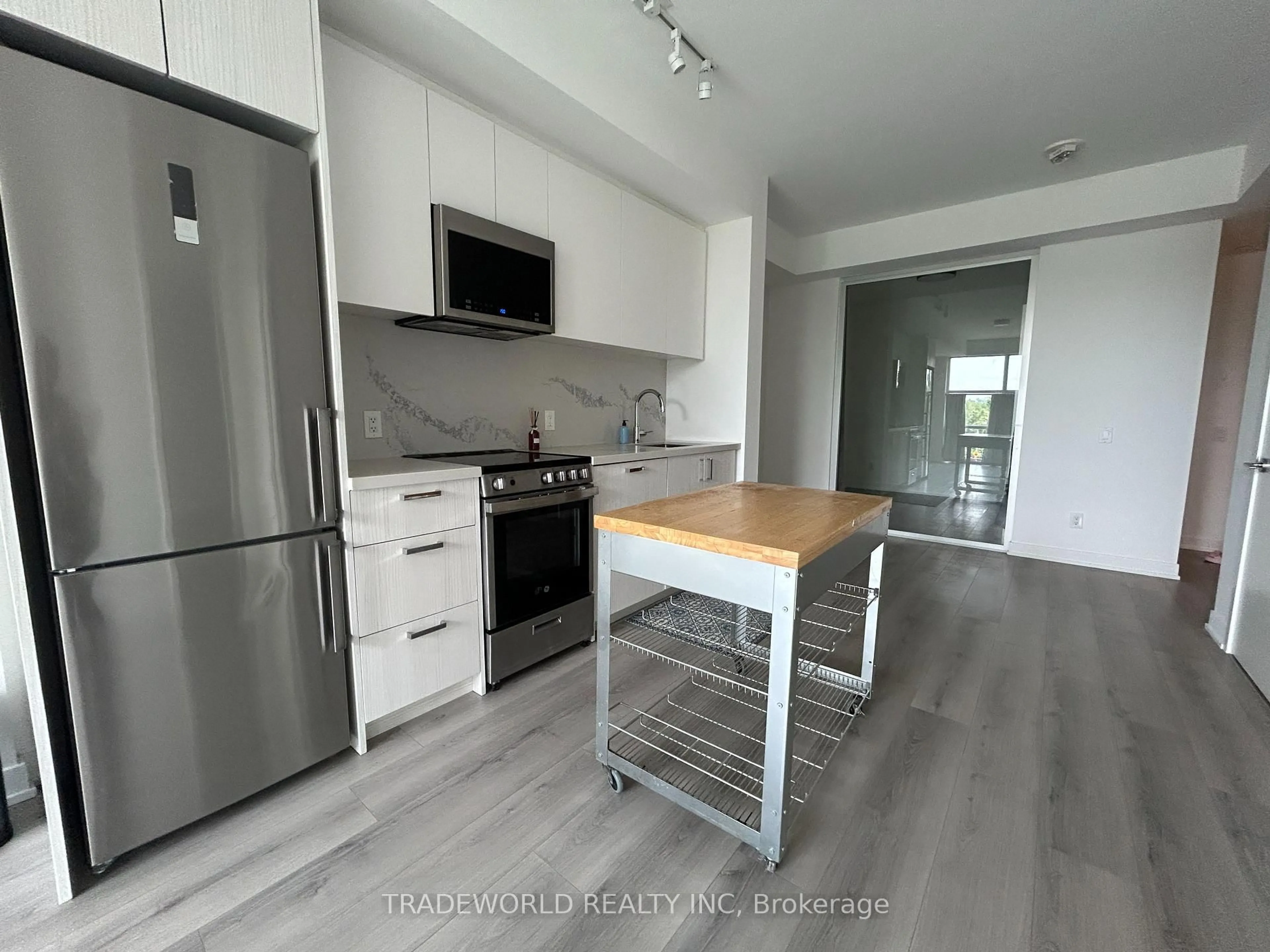 Open concept kitchen, wood/laminate floor for 1787 ST. CLAIR Ave #323, Toronto Ontario M6N 0B7