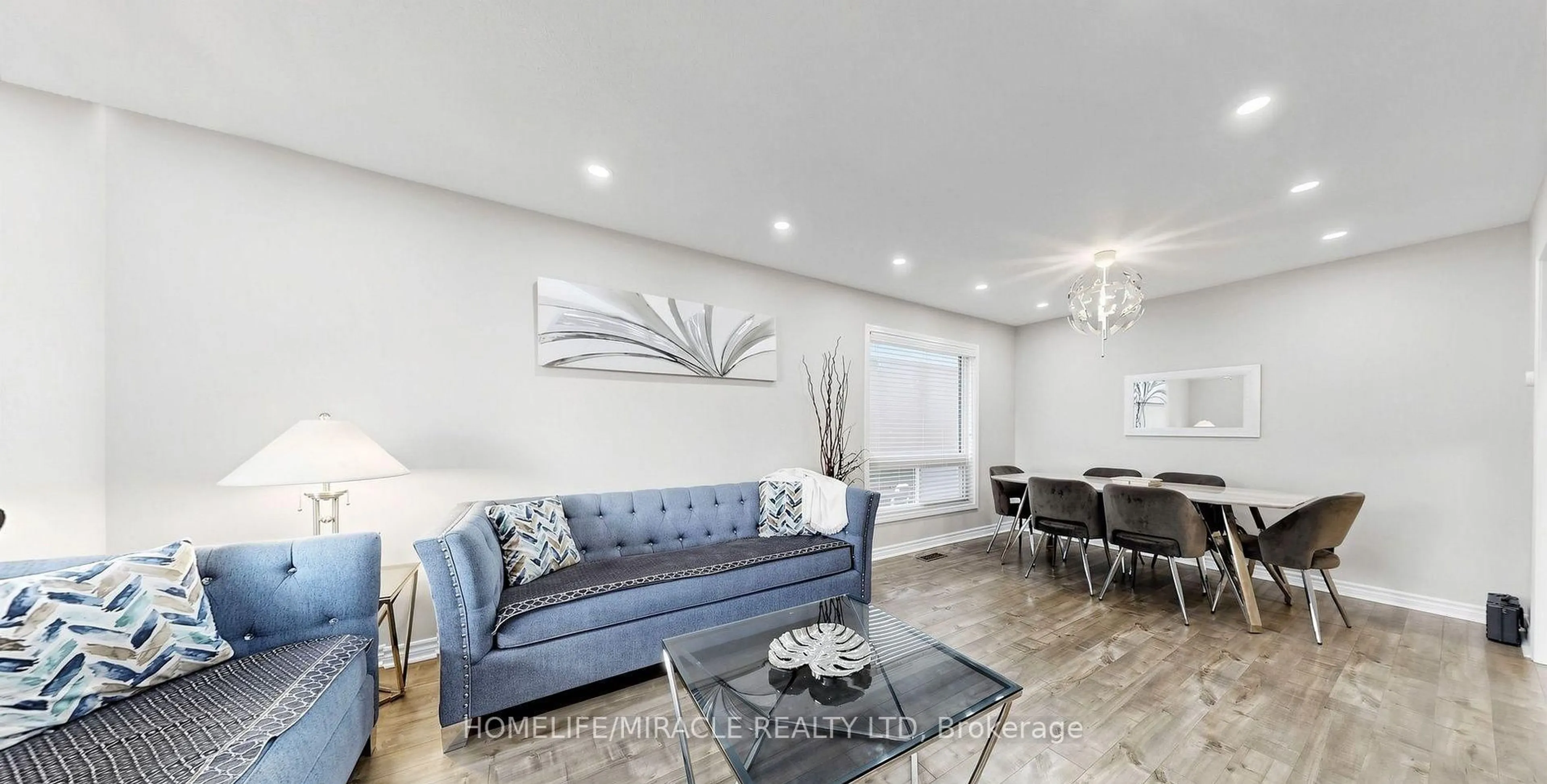 Living room with furniture, wood/laminate floor for 361 Brisdale Dr, Brampton Ontario L7A 3M6