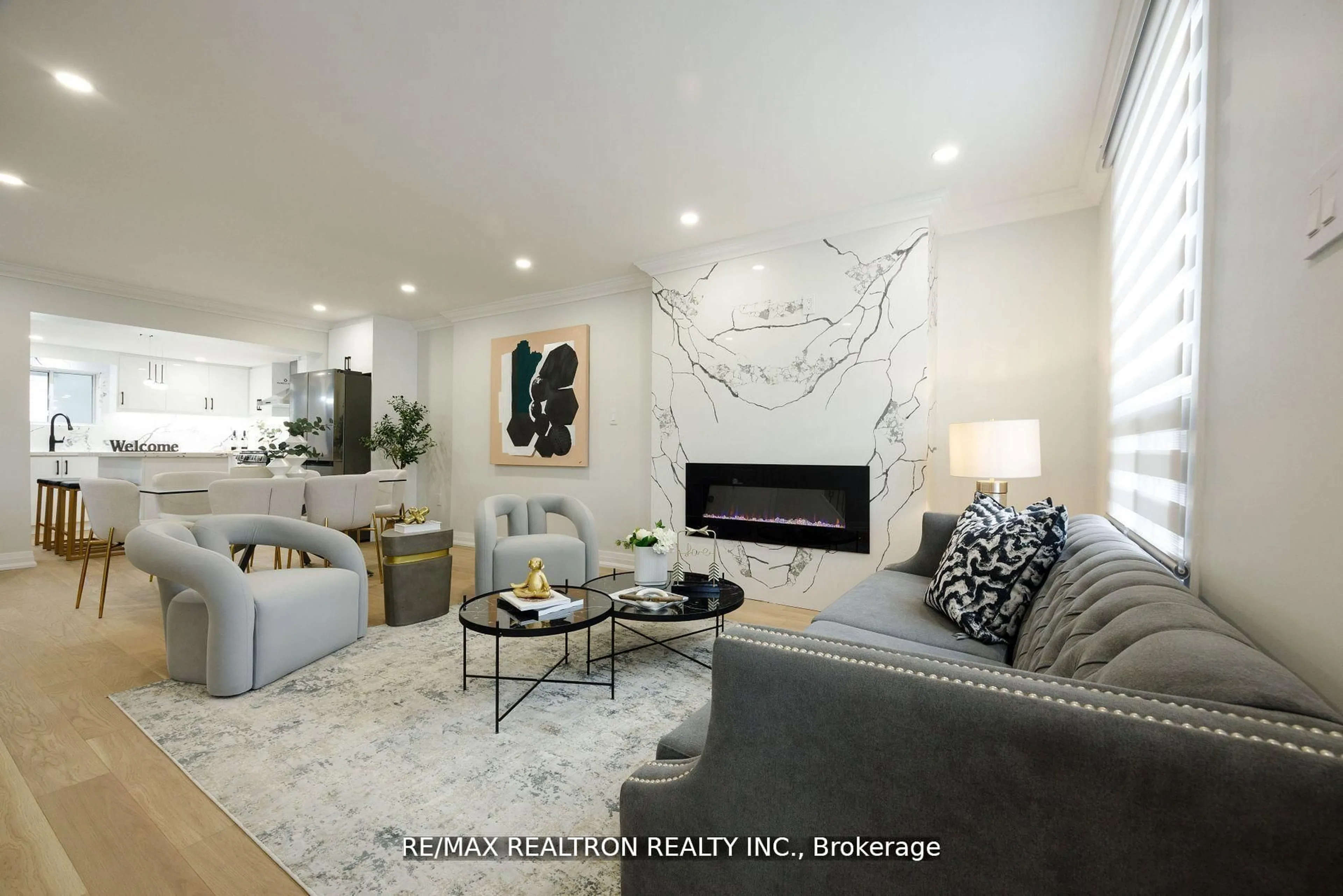 Living room with furniture, ceramic/tile floor for 77 Hatherley Rd, Toronto Ontario M6E 1V8