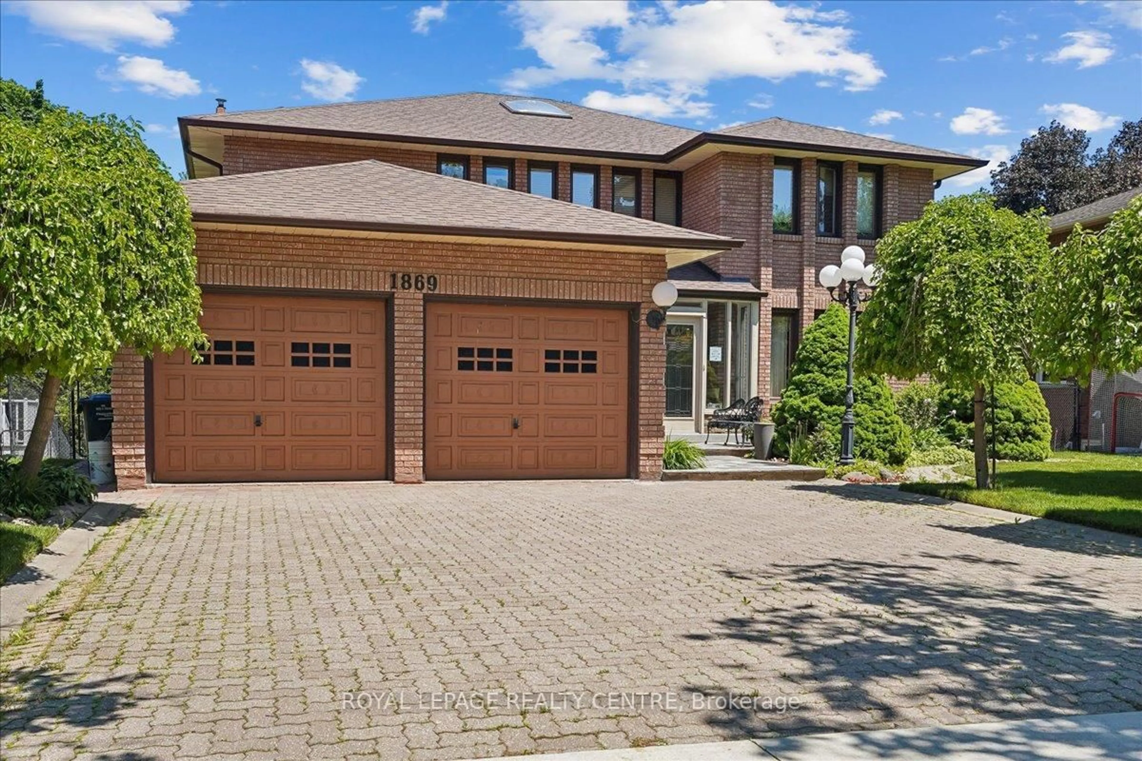 Home with brick exterior material, street for 1869 Folkway Dr, Mississauga Ontario L5L 2X1