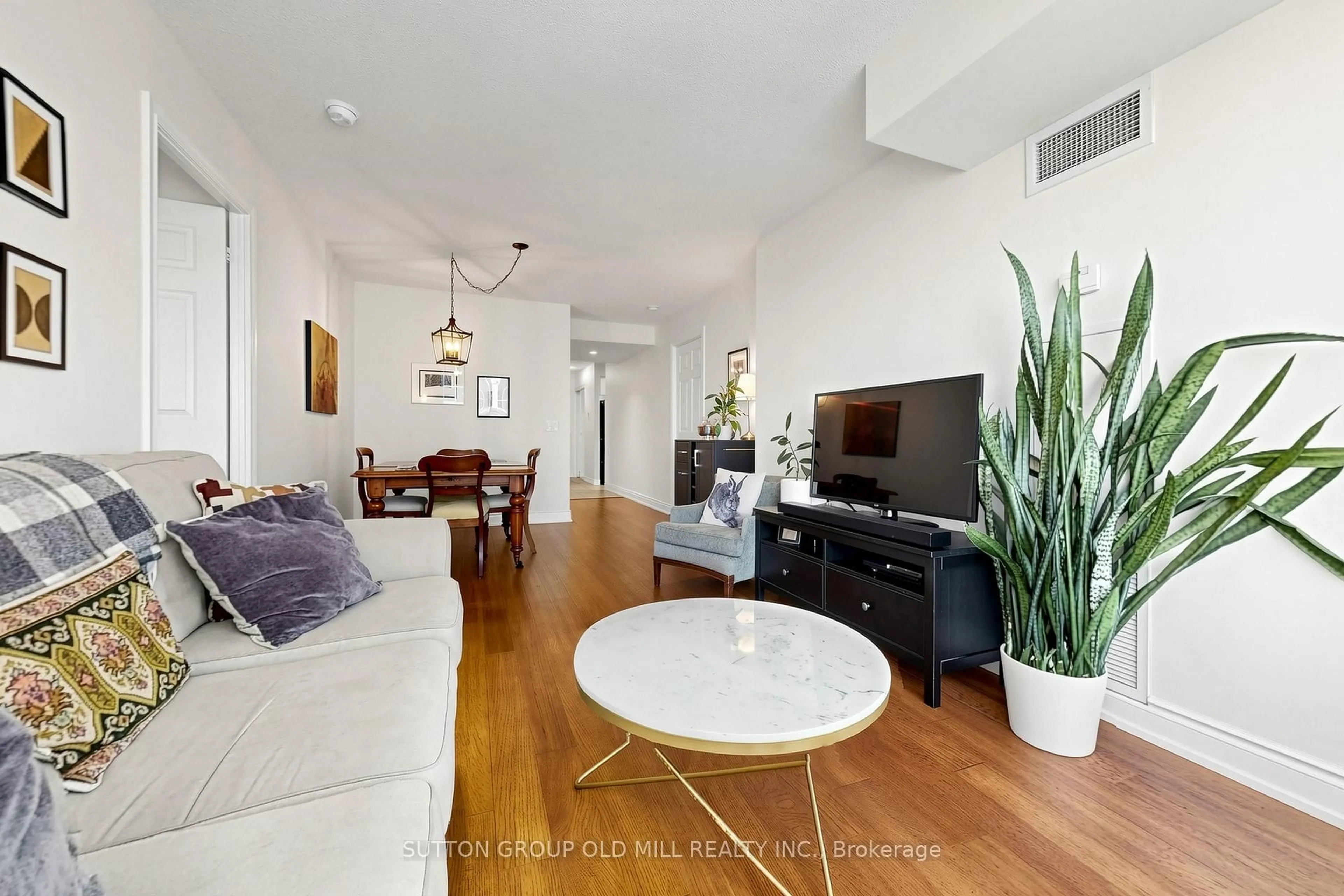 Living room with furniture, wood/laminate floor for 5233 Dundas St #1716, Toronto Ontario M9B 6M1
