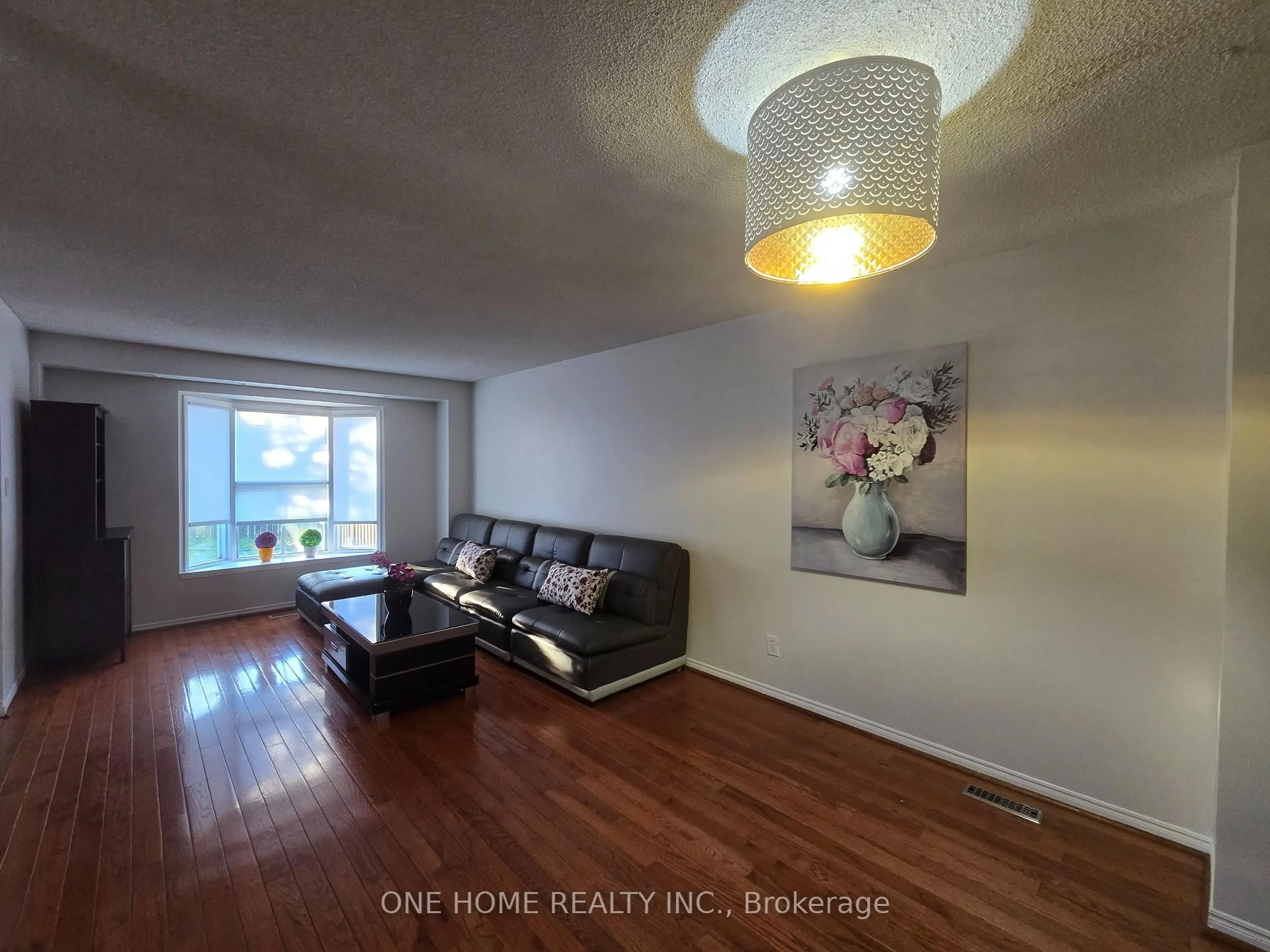 Living room with furniture, wood/laminate floor for 574 Galloway Cres, Mississauga Ontario L5C 4G6