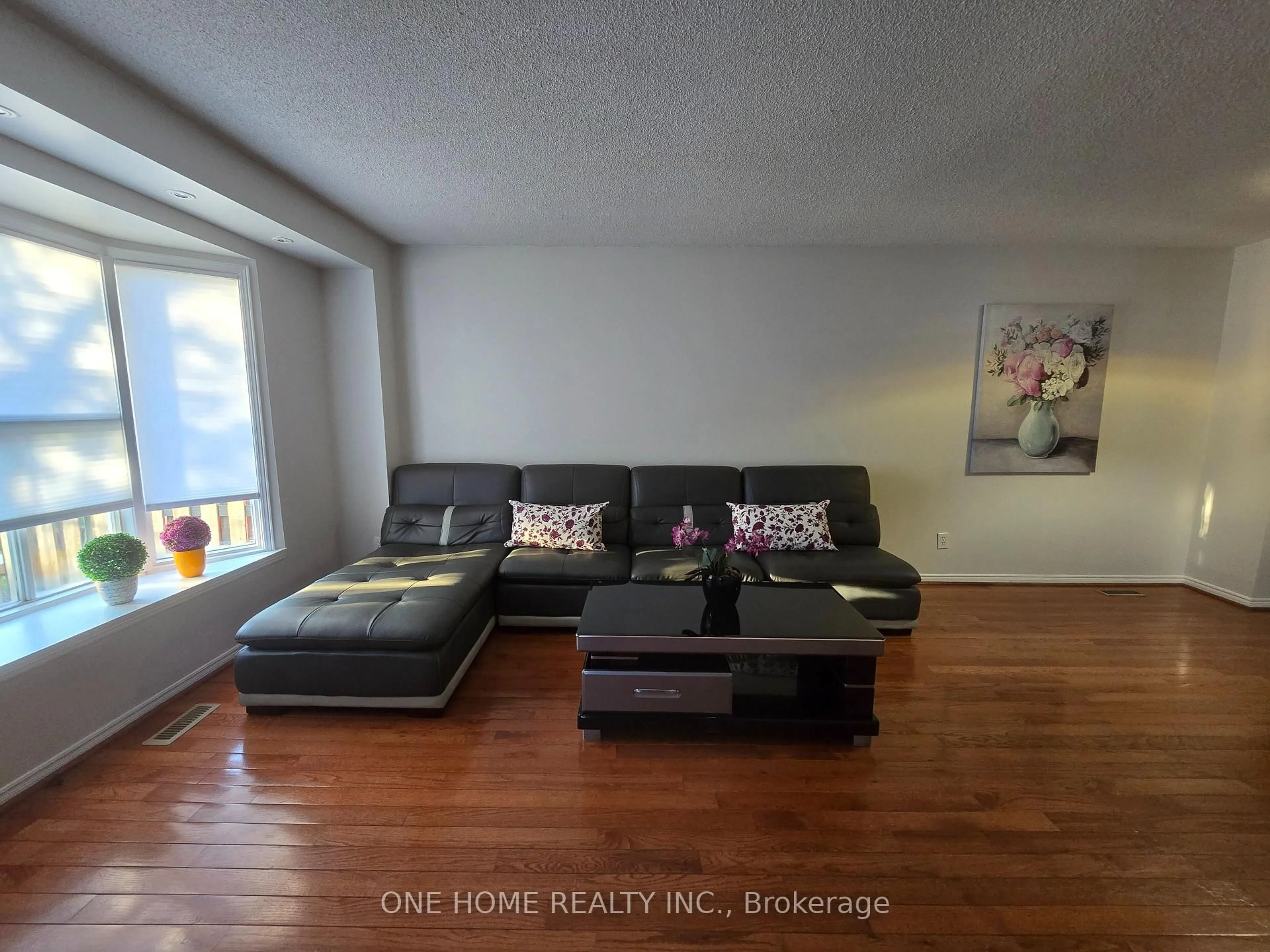 Living room with furniture, wood/laminate floor for 574 Galloway Cres, Mississauga Ontario L5C 4G6