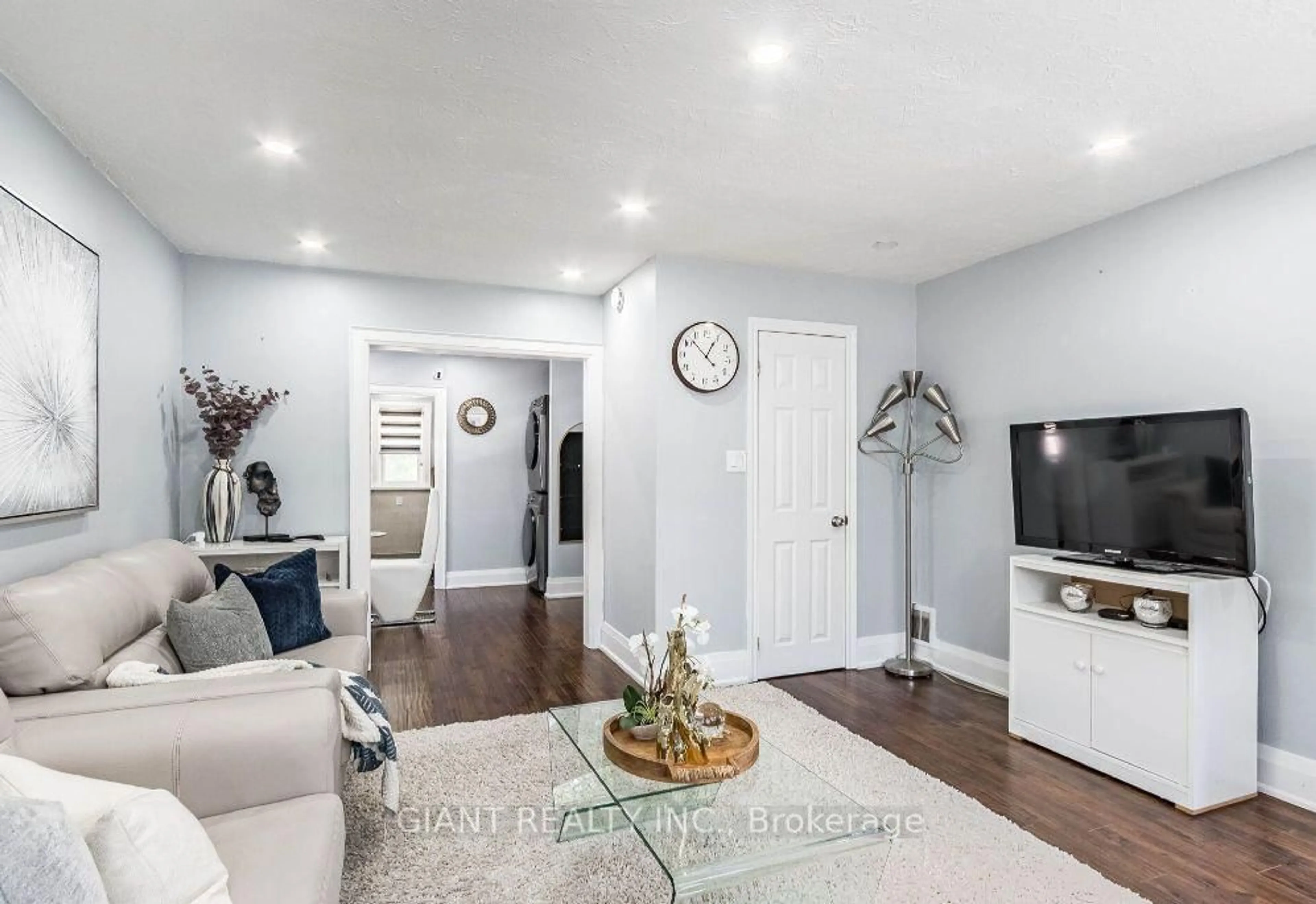 Living room with furniture, wood/laminate floor for 22 West St, Brampton Ontario L6X 1V7