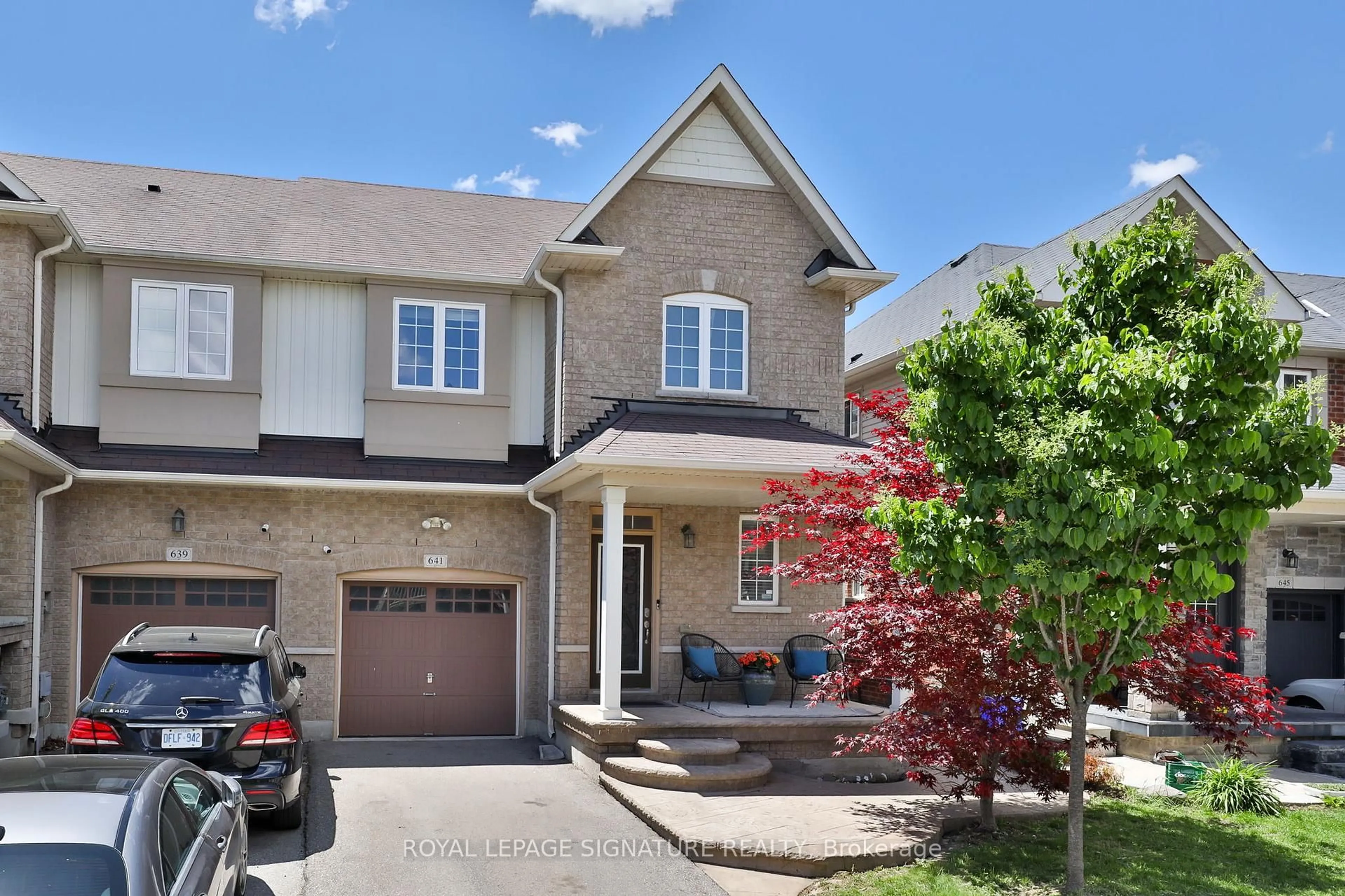 Home with brick exterior material, street for 641 Murray Meadows Pl, Milton Ontario L9T 8L7