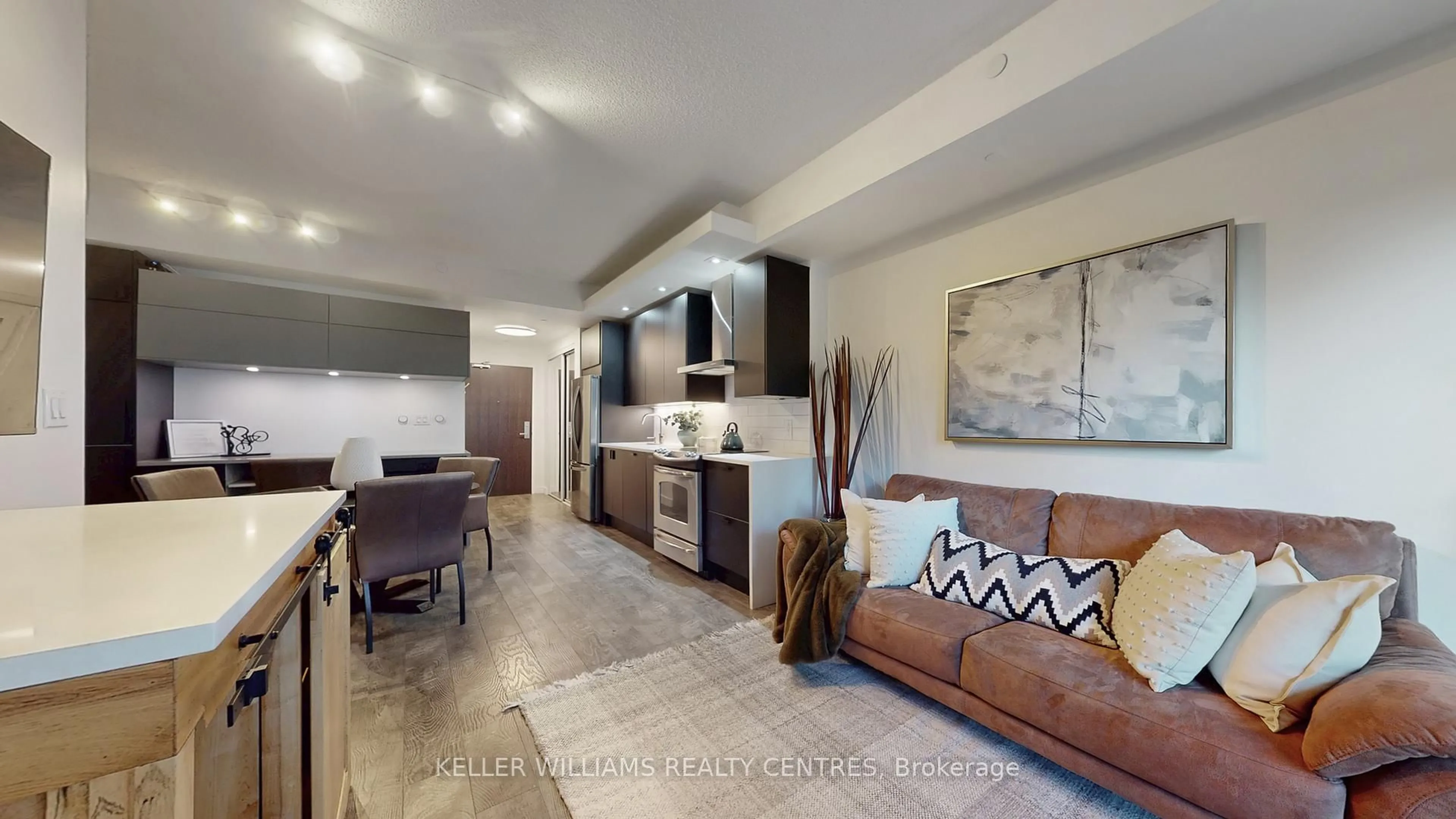 Living room with furniture, ceramic/tile floor for 165 Legion Rd #434, Toronto Ontario M8Y 0A1
