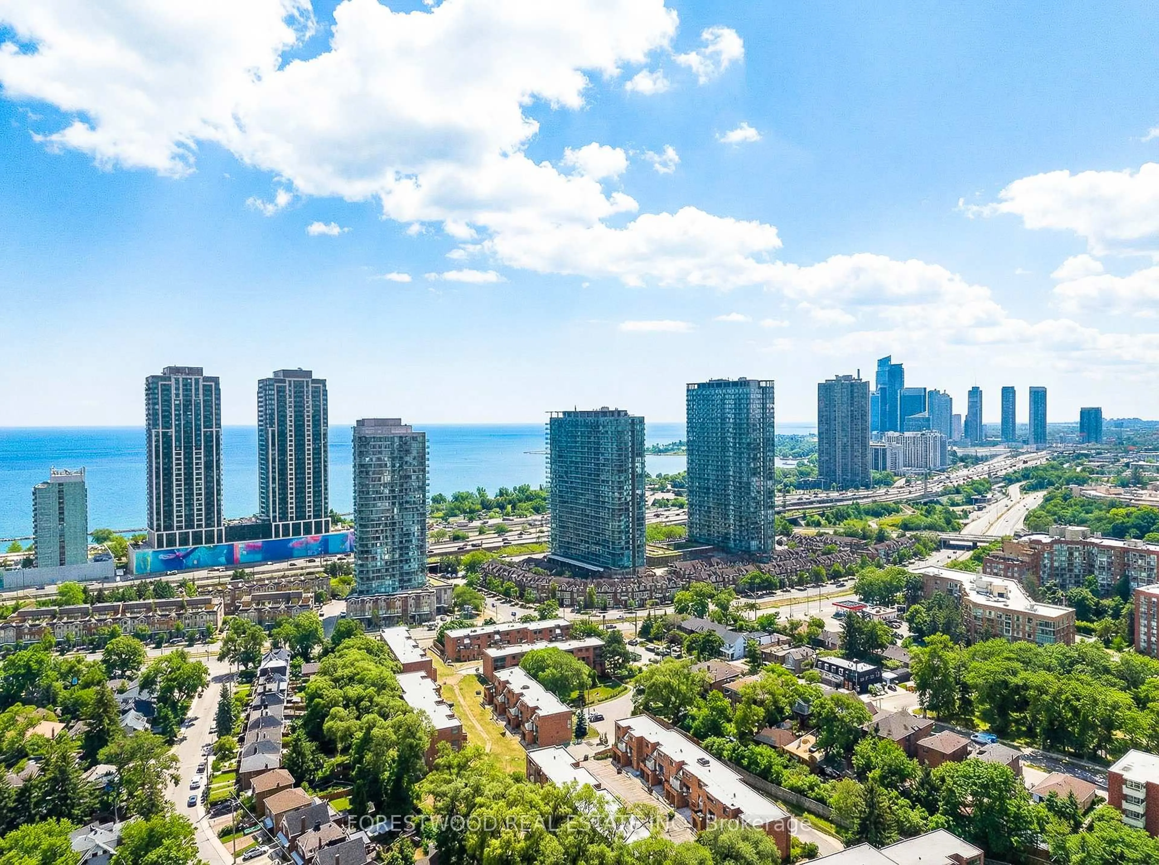 A pic from outside/outdoor area/front of a property/back of a property/a pic from drone, city buildings view from balcony for 65 Southport St #402, Toronto Ontario M6S 3N6