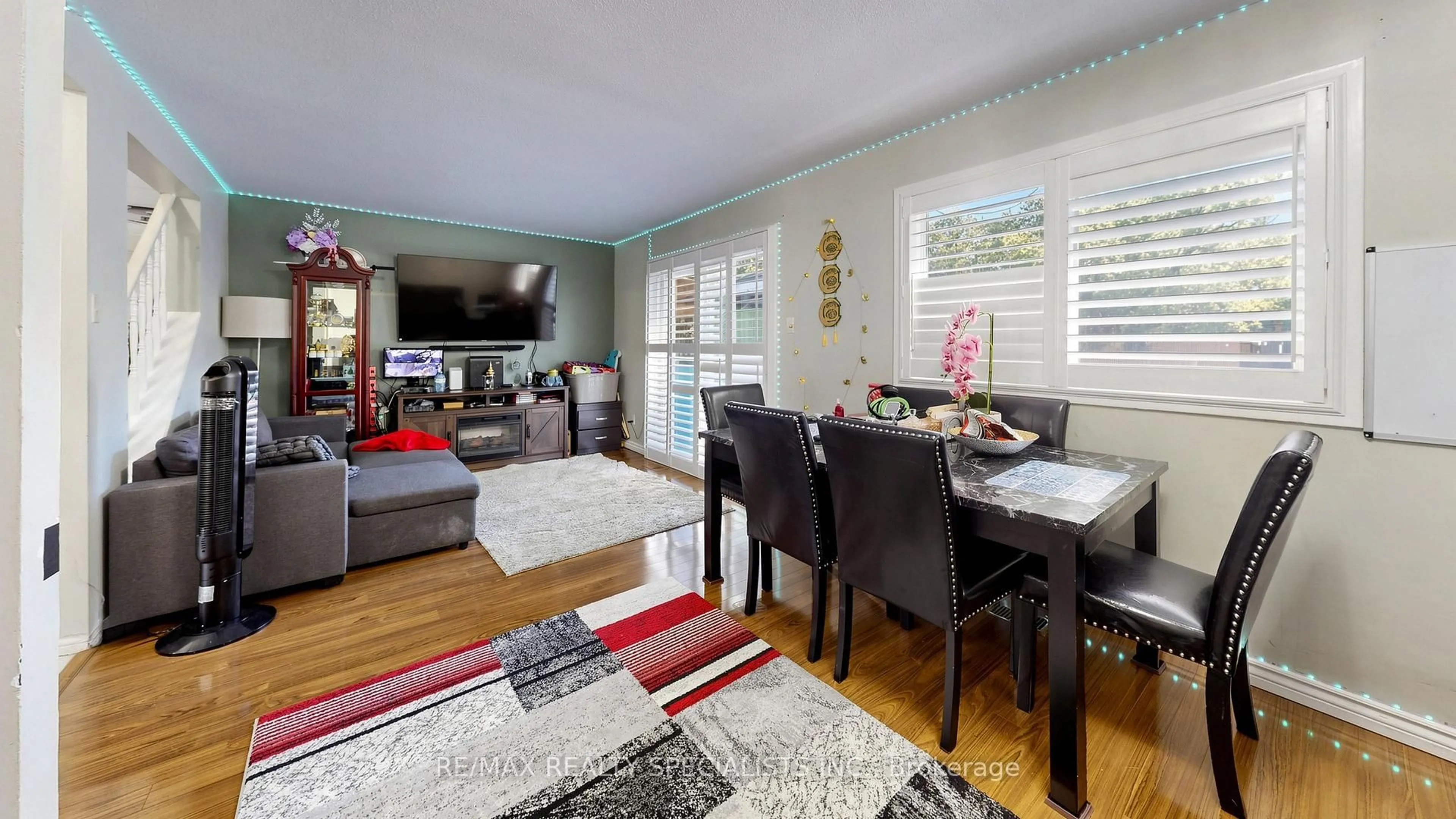 Living room with furniture, wood/laminate floor for 36 Grand Rapids Sq, Brampton Ontario L6S 2J5