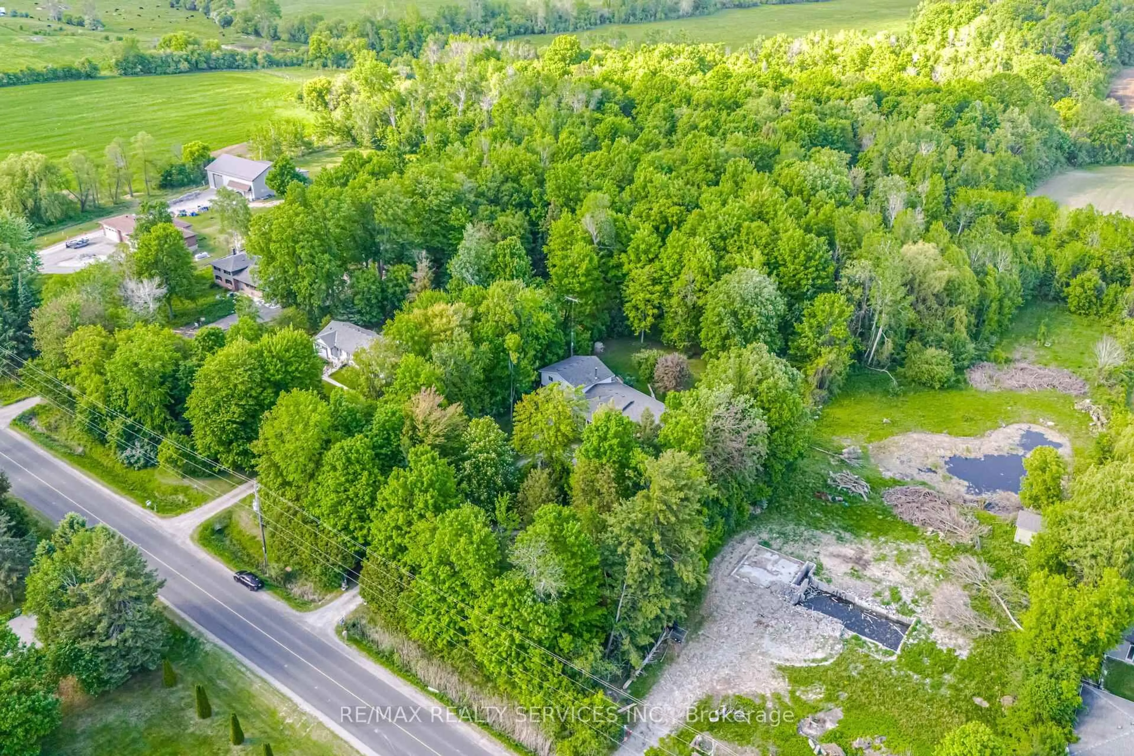 A pic from outside/outdoor area/front of a property/back of a property/a pic from drone, forest/trees view for 14411 Innis Lake Rd, Caledon Ontario L7C 2Z8