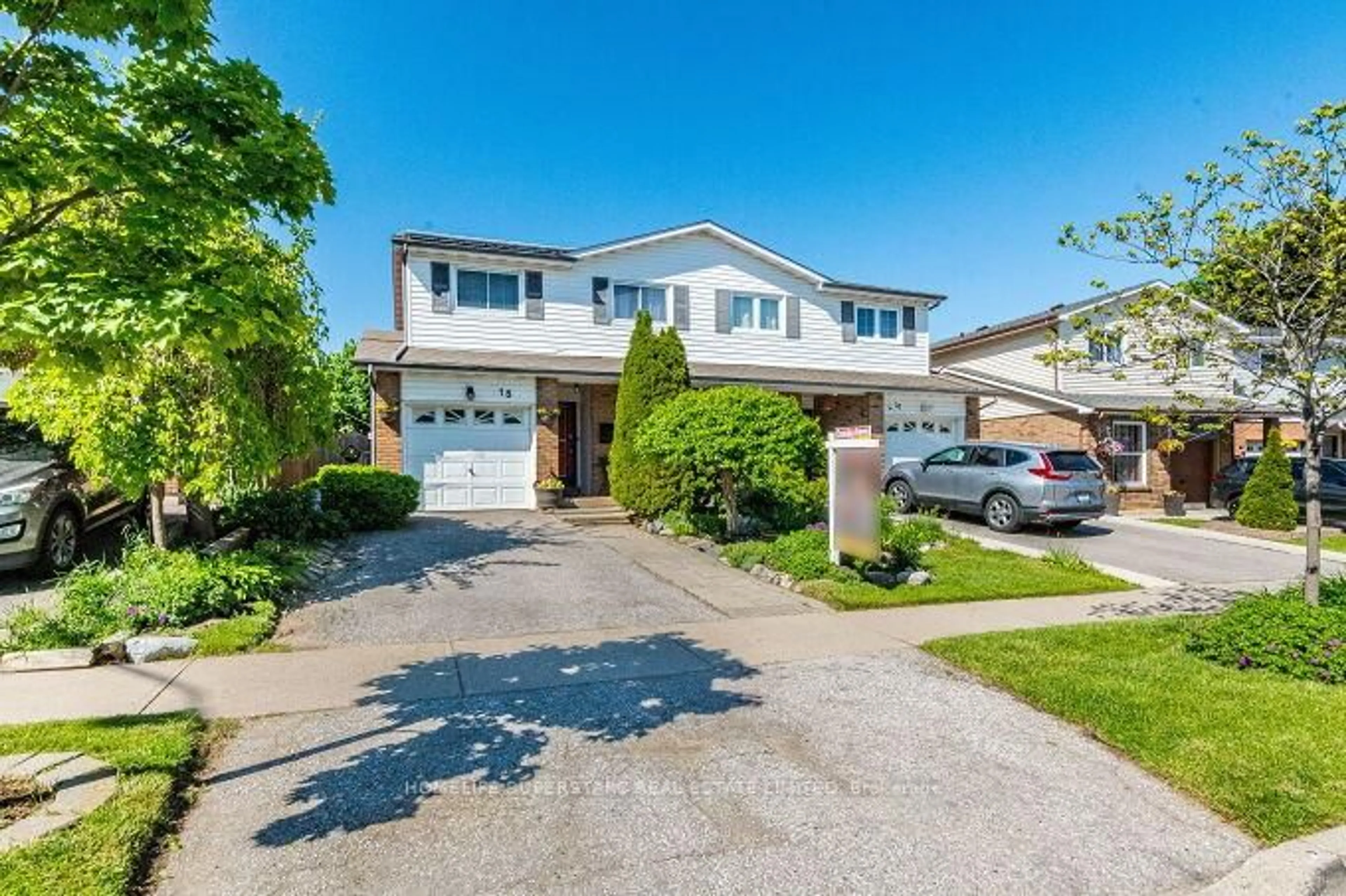 Home with vinyl exterior material, street for 18 Pluto Dr, Brampton Ontario L6V 3W5