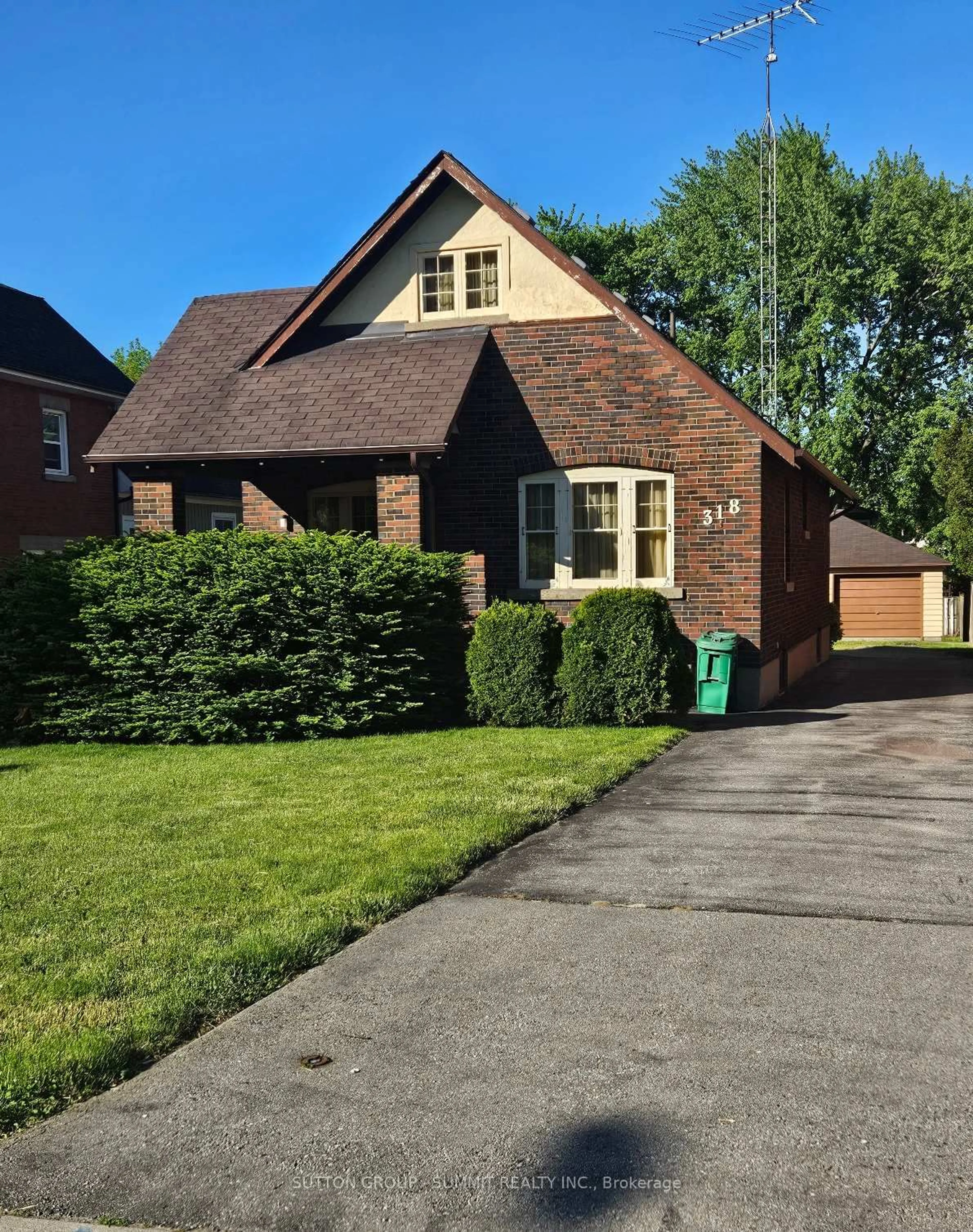 Home with brick exterior material, street for 318 Queen St, Mississauga Ontario L5M 1M2