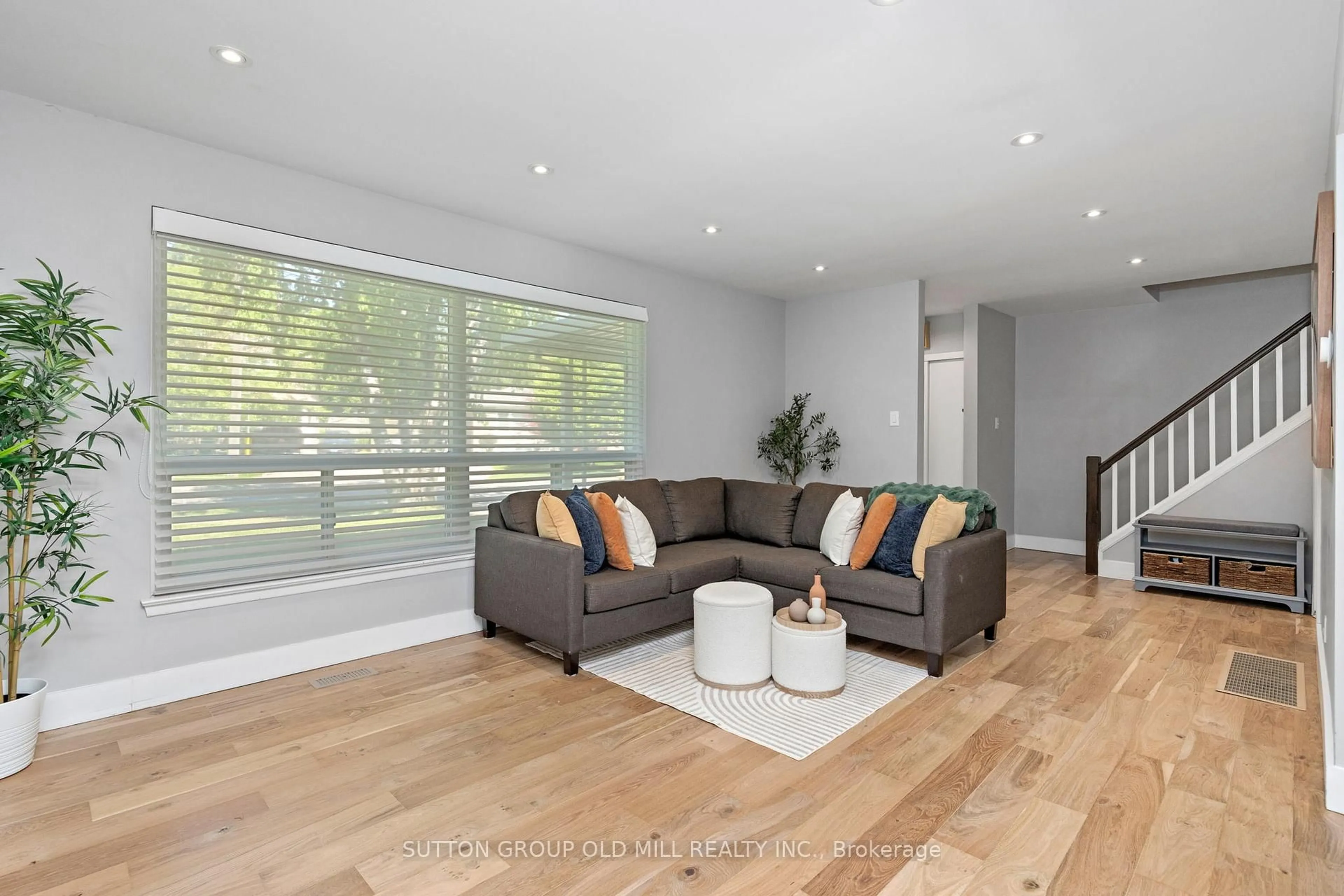 Living room with furniture, wood/laminate floor for 47 Ashfield Dr, Toronto Ontario M9C 4T7