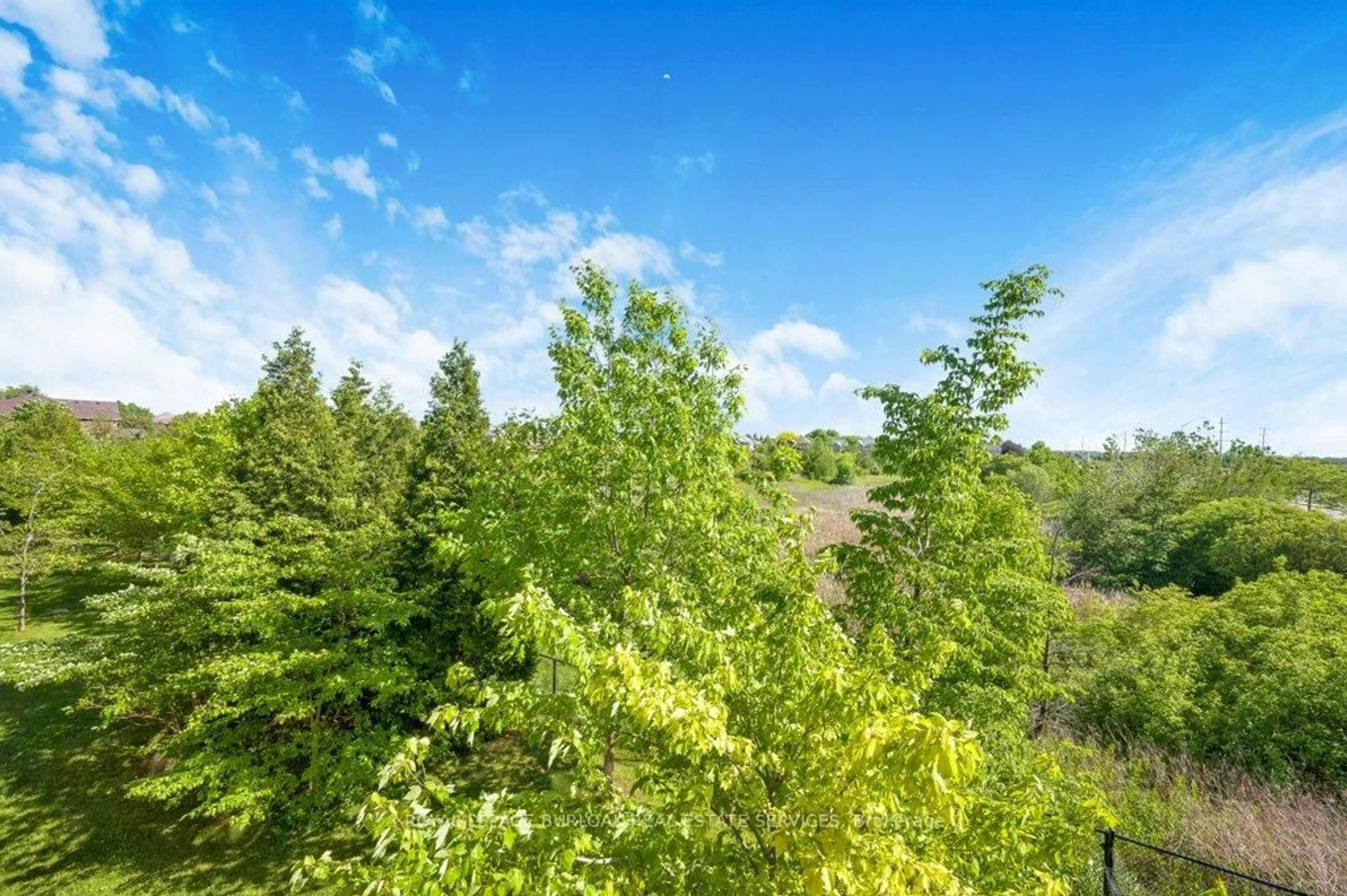 A pic from outside/outdoor area/front of a property/back of a property/a pic from drone, forest/trees view for 5327 Upper Middle Rd #214, Burlington Ontario L7L 0E9