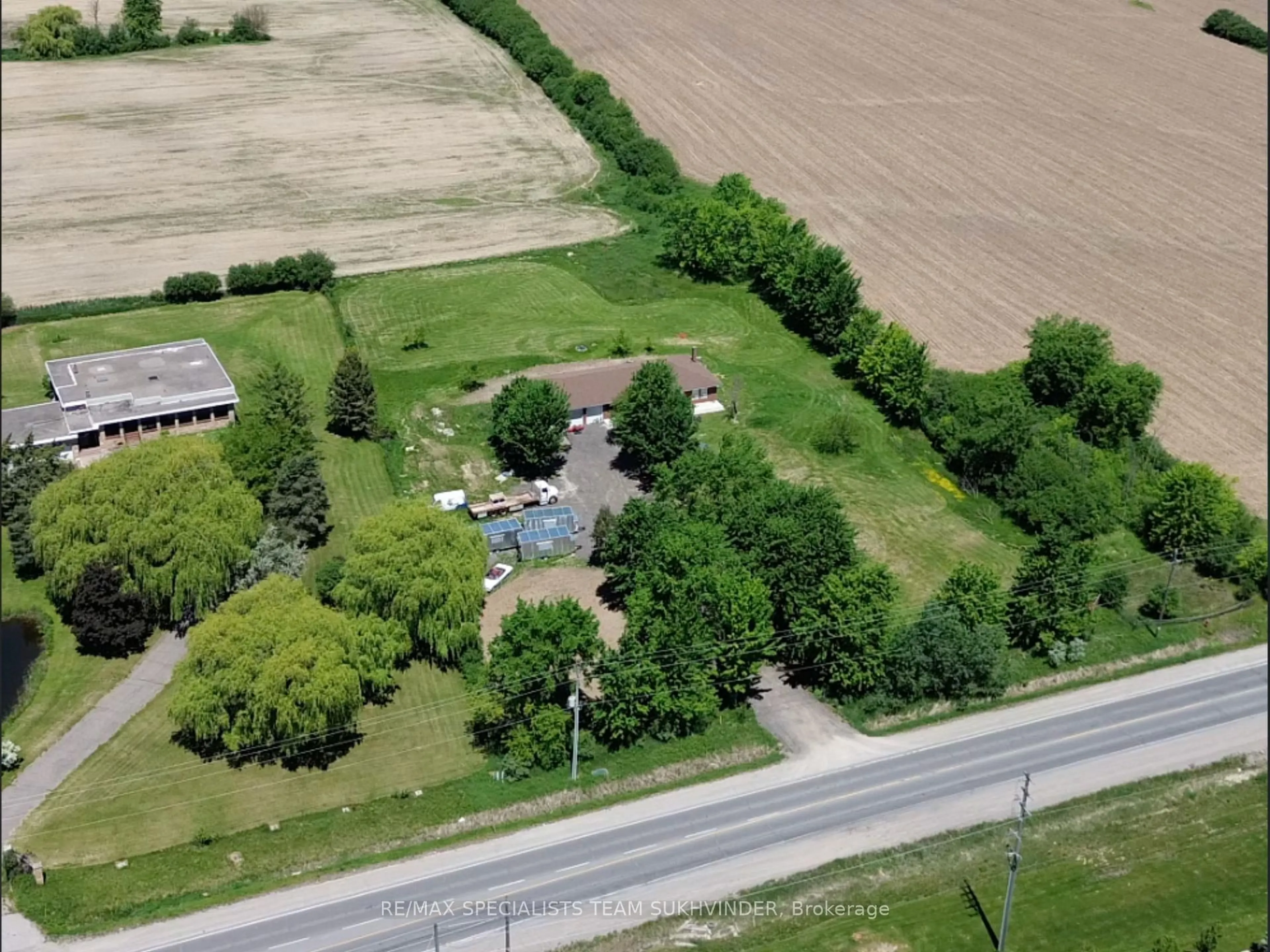 A pic from outside/outdoor area/front of a property/back of a property/a pic from drone, street for 7236 Mayfield Rd, Caledon Ontario L7C 0Z9