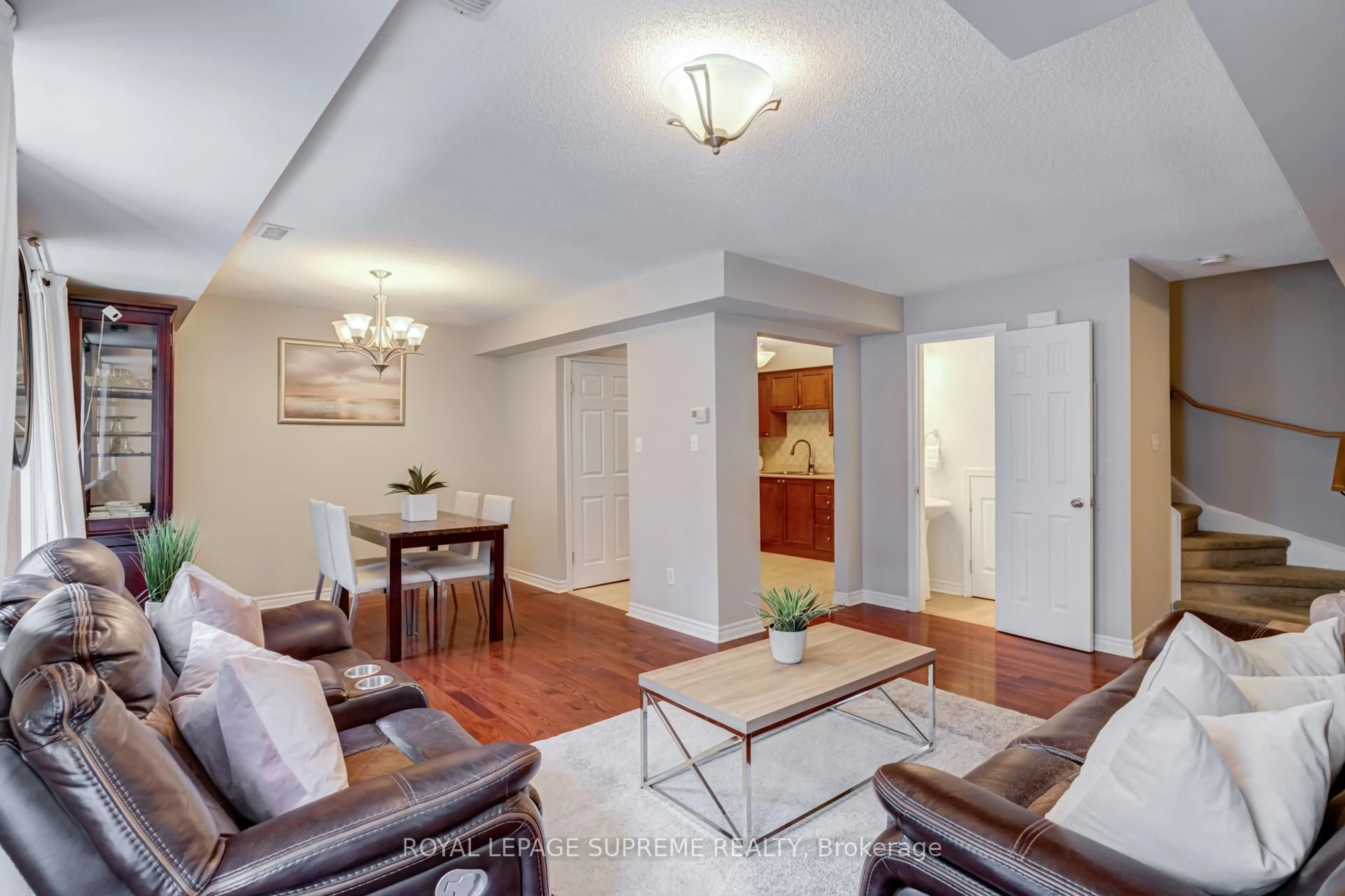 Living room with furniture, wood/laminate floor for 64 Sidney Belsey Cres #307, Toronto Ontario M6M 5J4