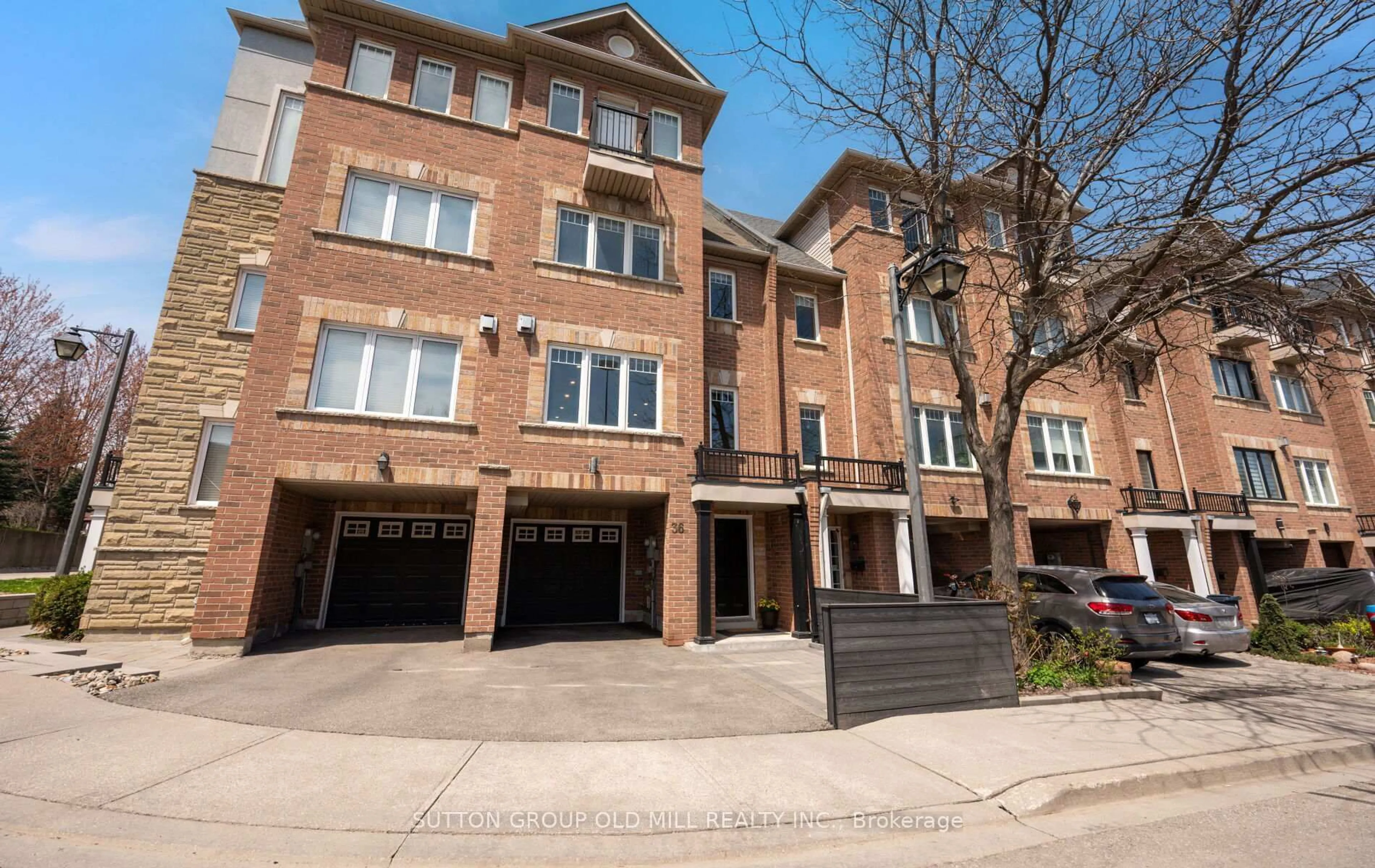 Home with brick exterior material, street for 36 Clockwork Lane, Toronto Ontario M8Y 4H5