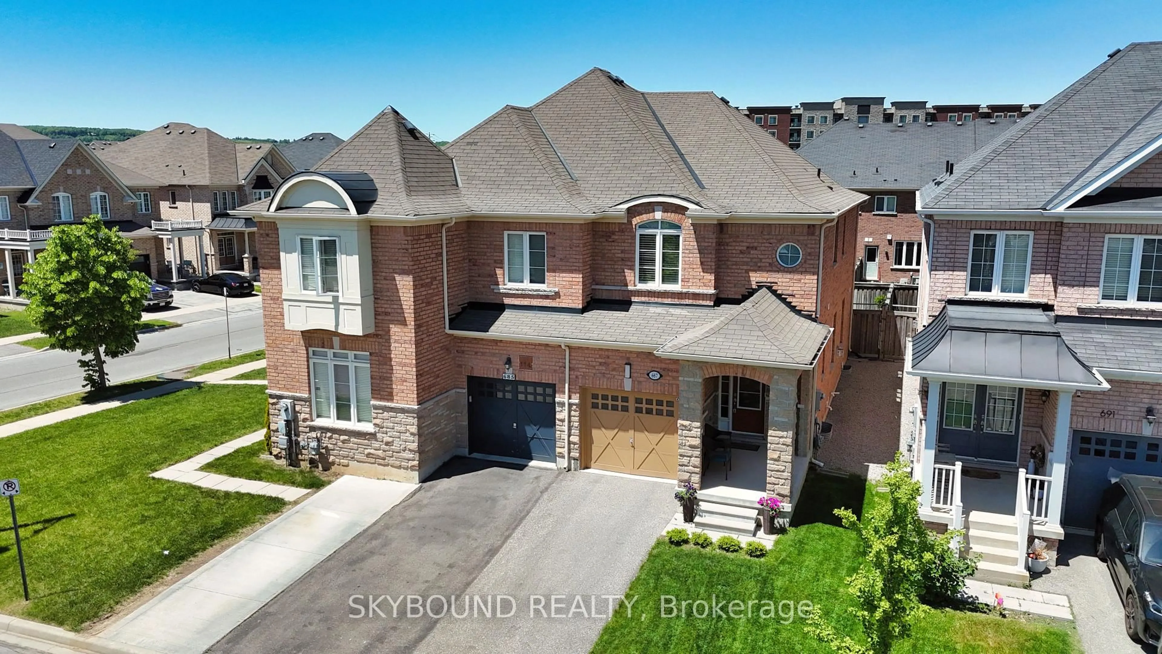 A pic from outside/outdoor area/front of a property/back of a property/a pic from drone, street for 687 Megson Terr, Milton Ontario L9T 8K4