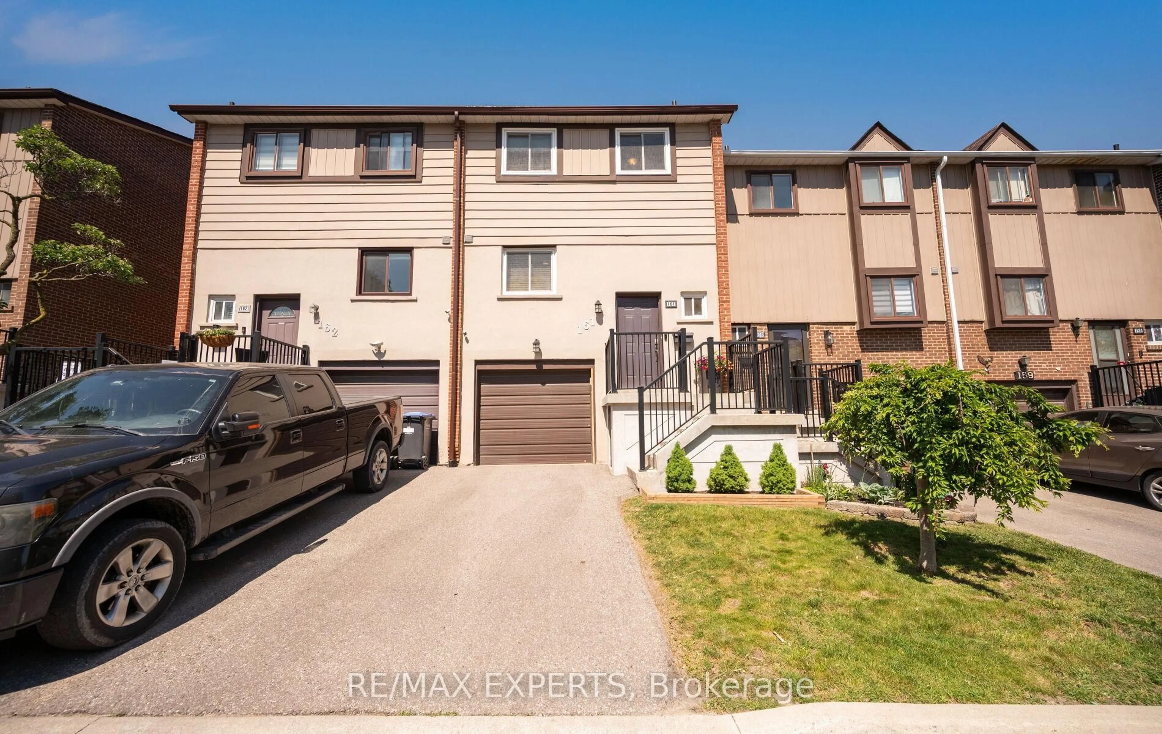 A pic from outside/outdoor area/front of a property/back of a property/a pic from drone, street for 161 Moregate Cres #15, Brampton Ontario L6S 3K9