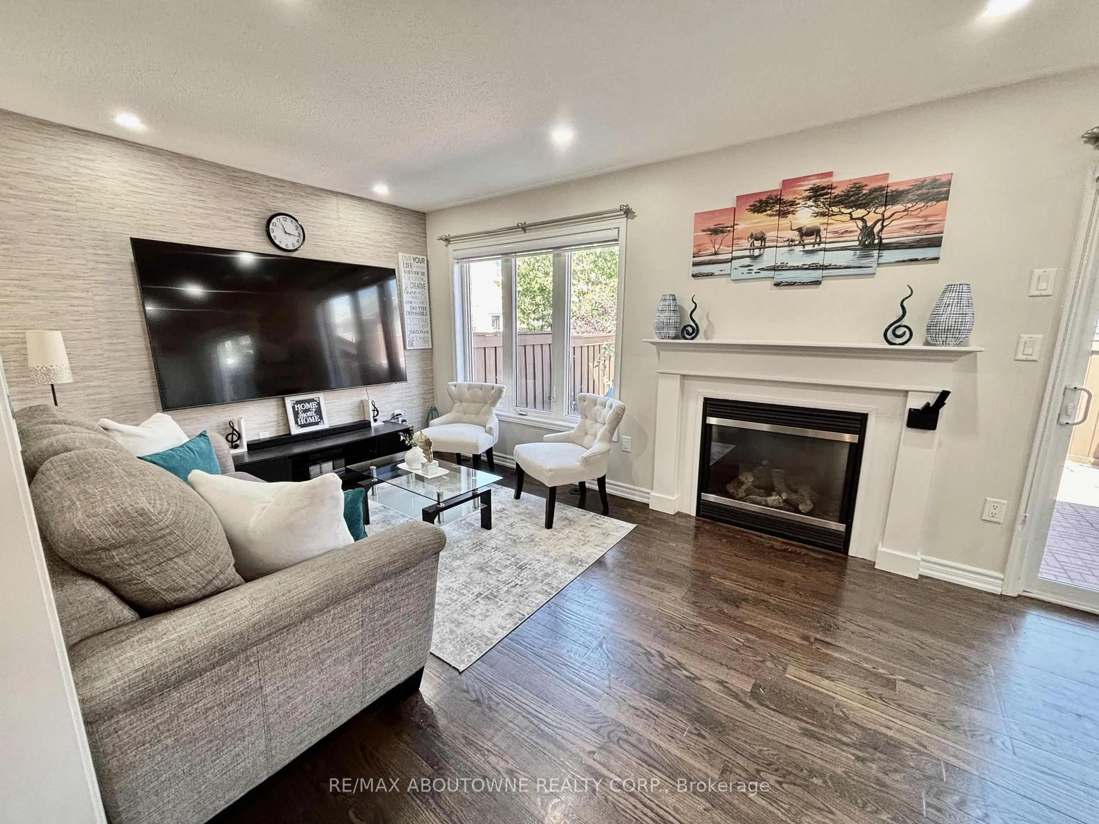 Living room with furniture, wood/laminate floor for 36 Van Fleet Terr, Milton Ontario L9T 0Y4