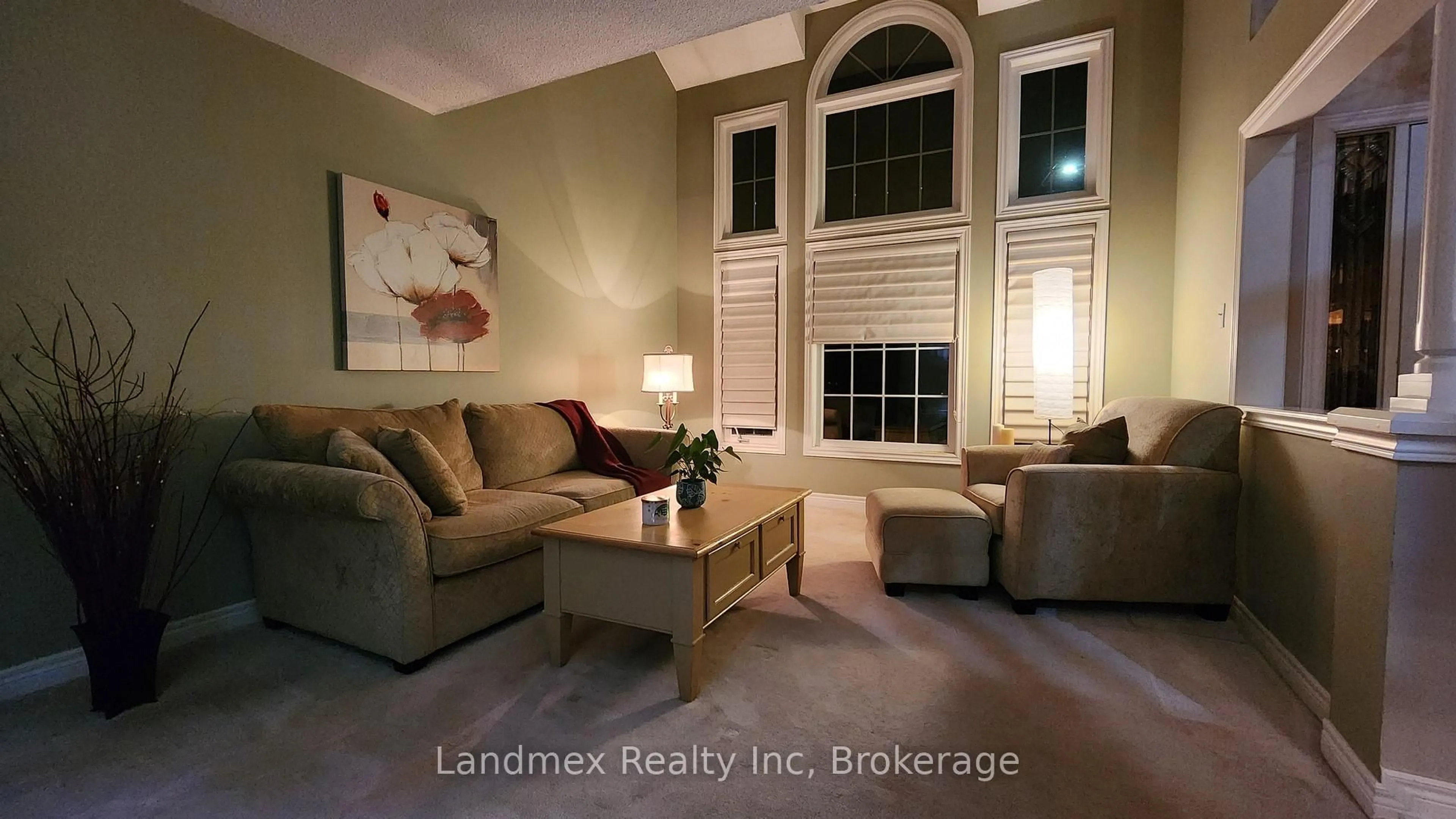 Living room with furniture, wood/laminate floor for 5423 Planter's Wood Crt, Mississauga Ontario L5M 5V6