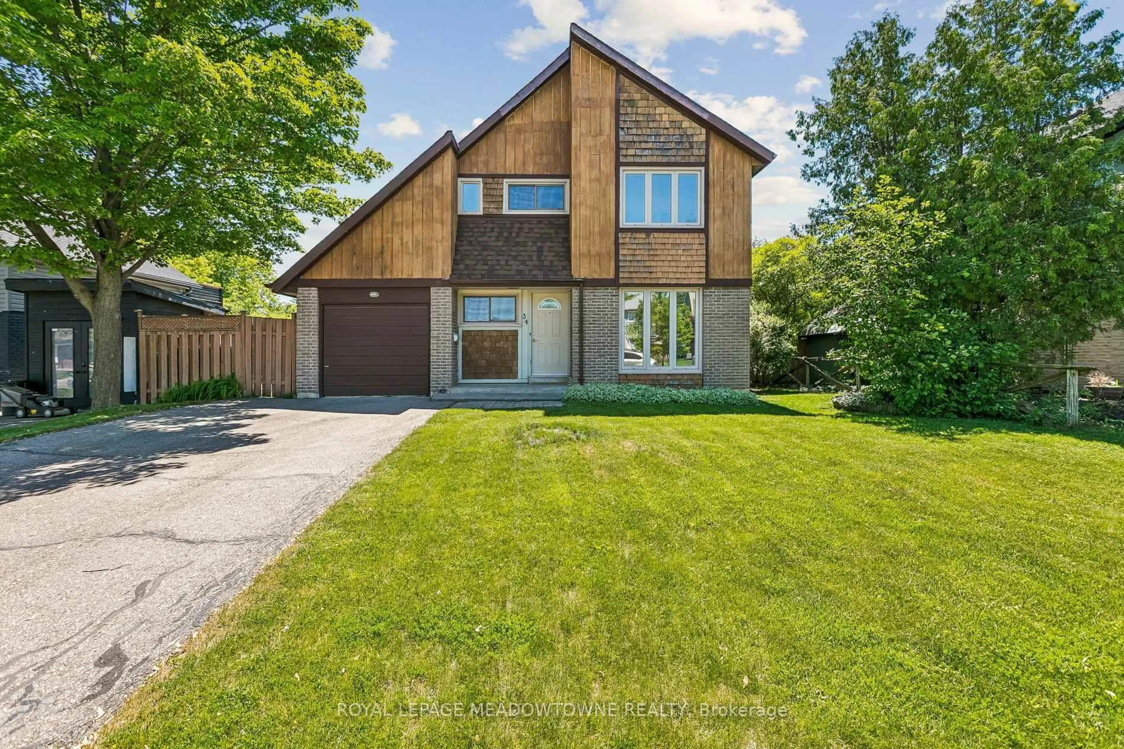 Home with brick exterior material, street for 34 Plainsman Rd, Mississauga Ontario L5N 1C7