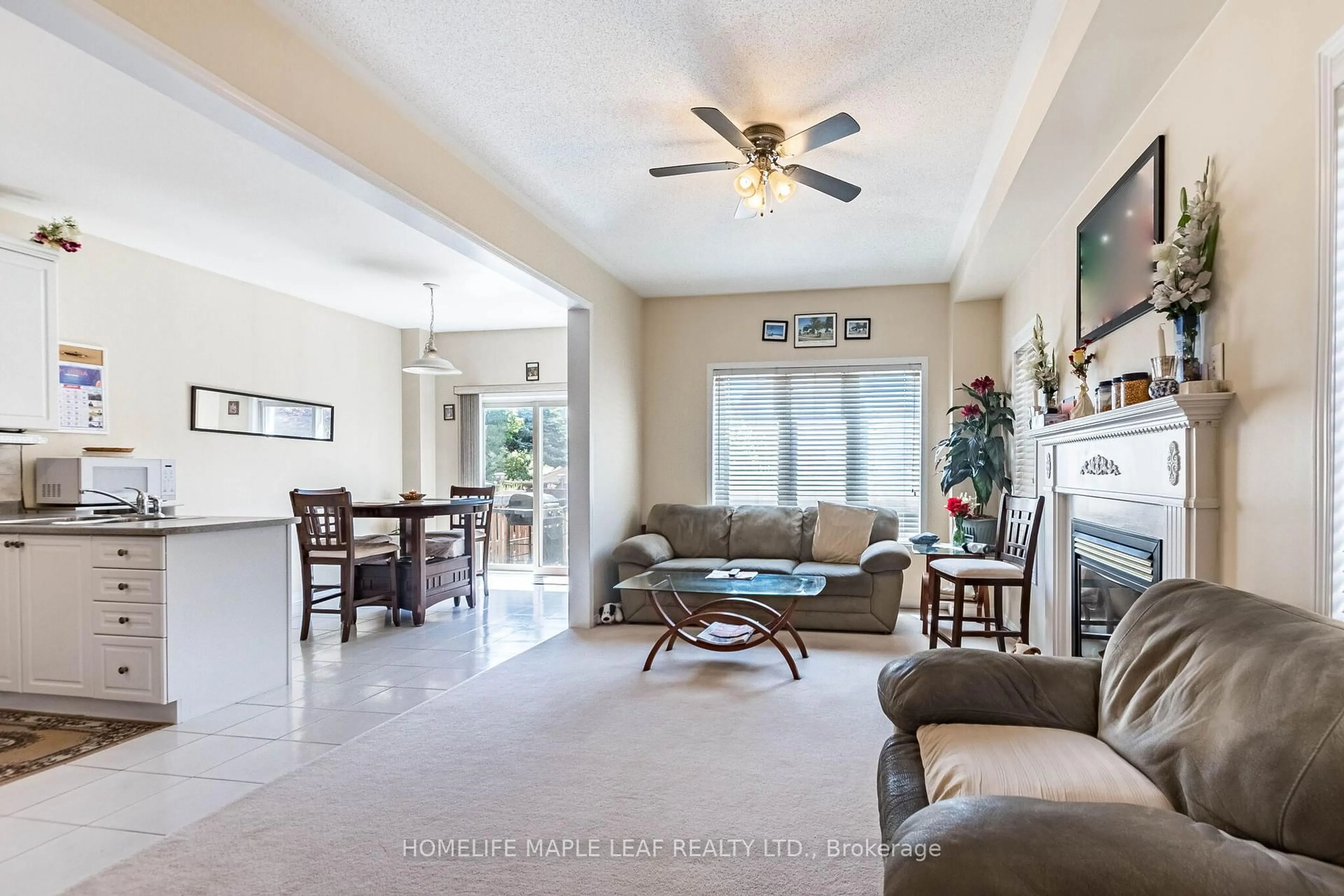Living room with furniture, ceramic/tile floor for 73 Meadowlark Dr, Halton Hills Ontario L7G 6N6