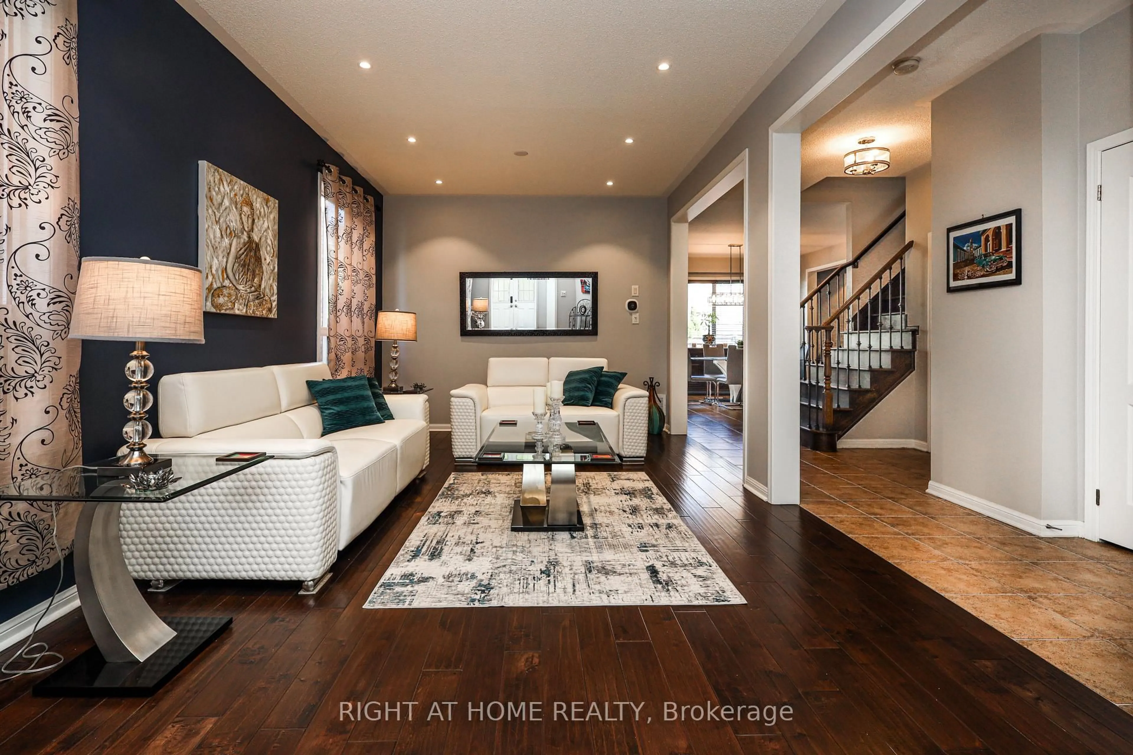 Living room with furniture, wood/laminate floor for 978 Cousens Terr, Milton Ontario L9T 0E1