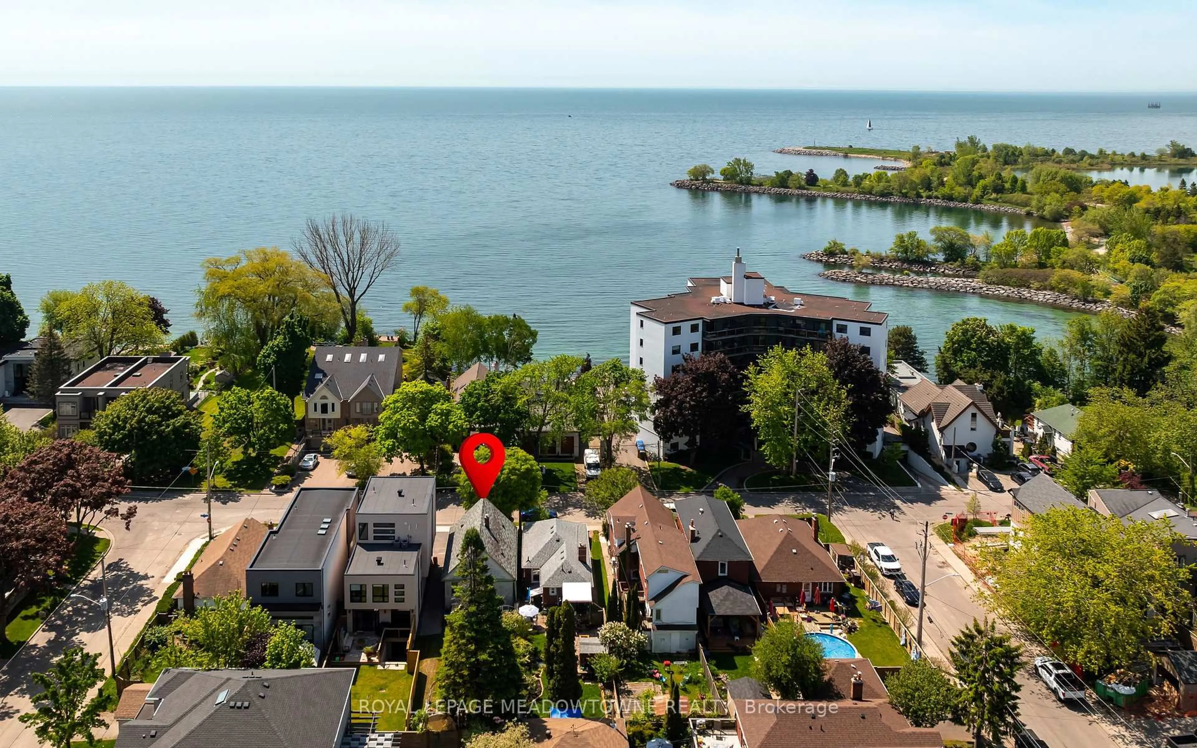 A pic from outside/outdoor area/front of a property/back of a property/a pic from drone, water/lake/river/ocean view for 182 lakeshore Dr, Toronto Ontario M8V 2A9