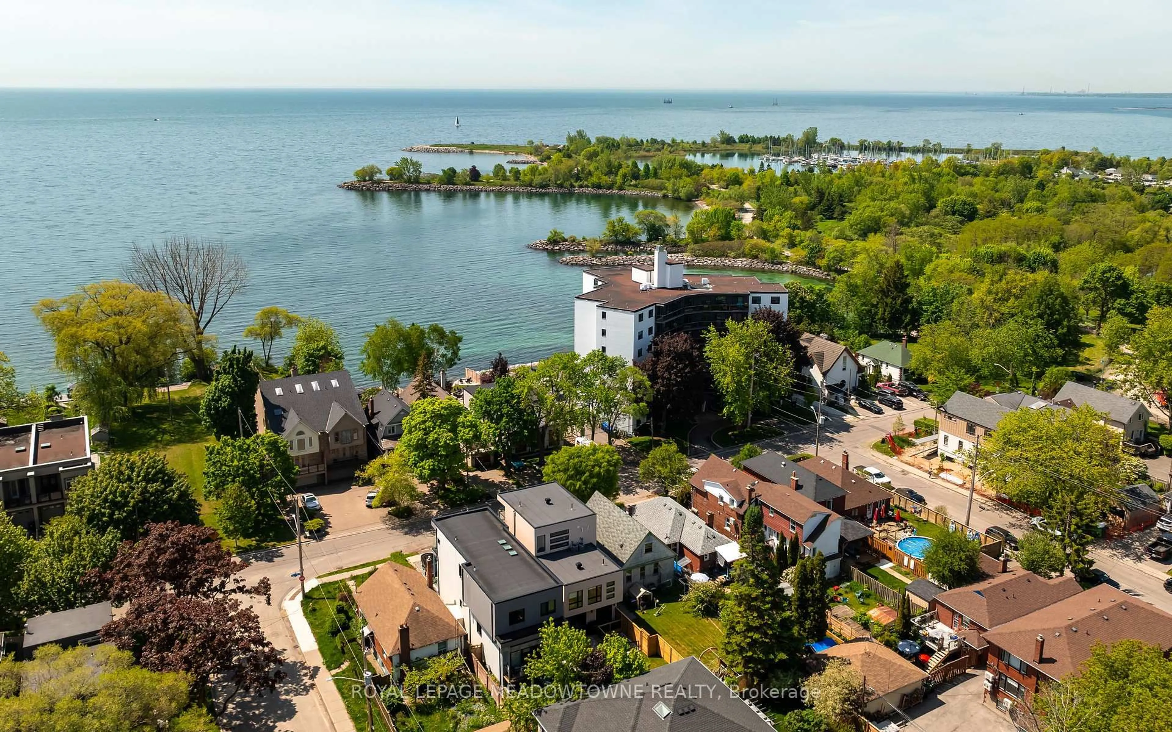 A pic from outside/outdoor area/front of a property/back of a property/a pic from drone, water/lake/river/ocean view for 182 lakeshore Dr, Toronto Ontario M8V 2A9