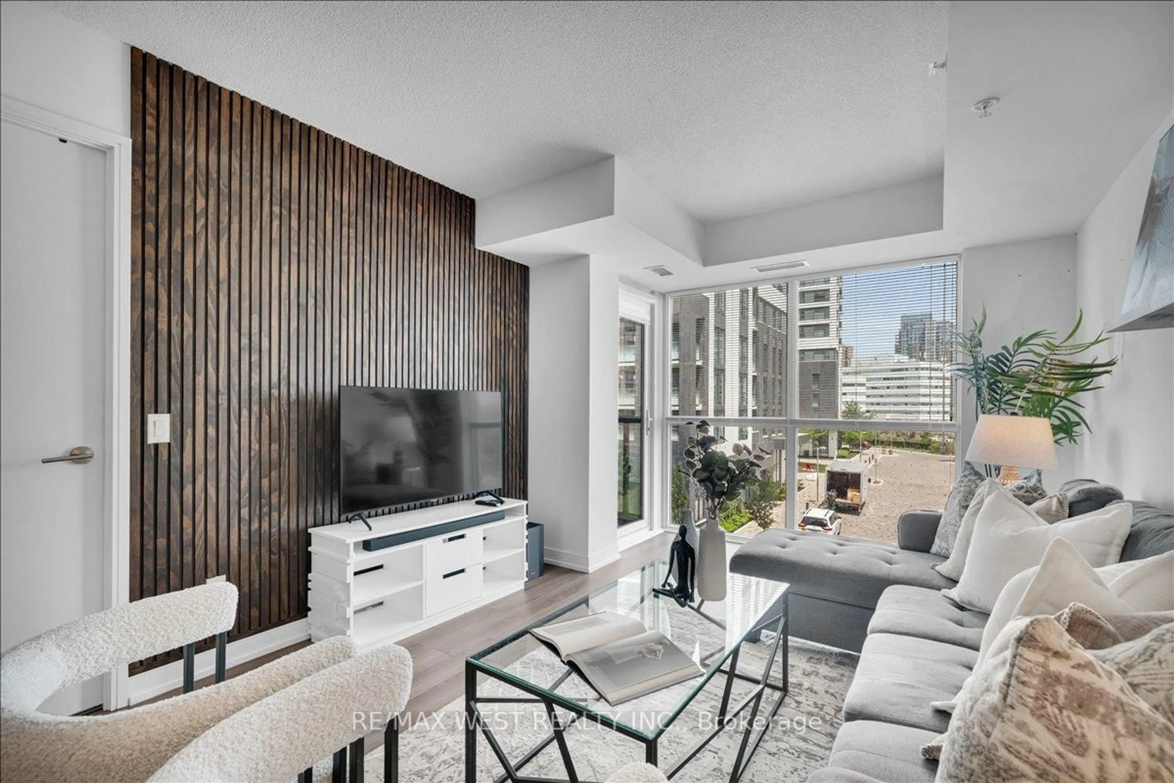 Living room with furniture, unknown for 20 Thomas Riley Rd #306, Toronto Ontario M9B 0C3