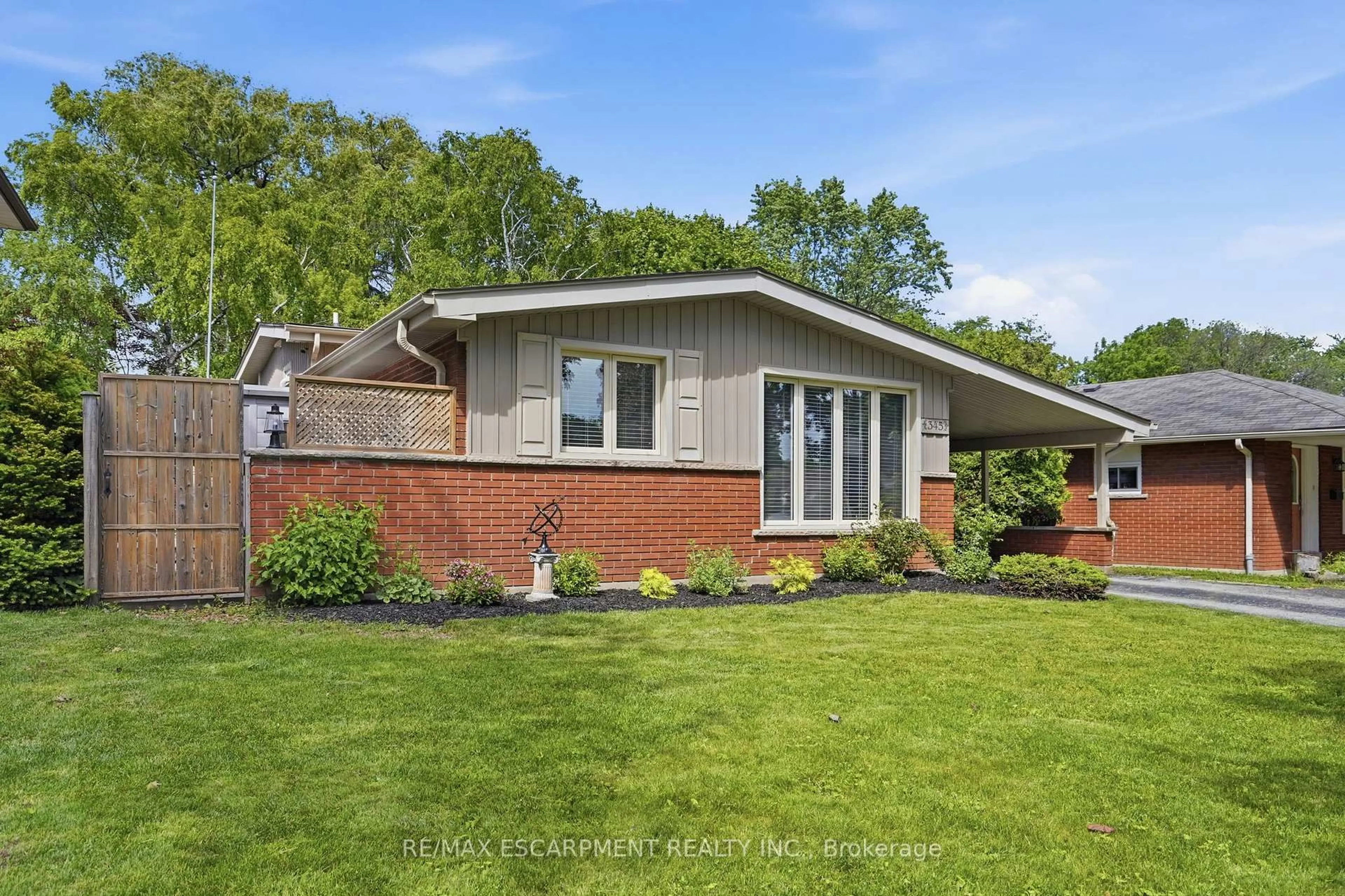 Home with brick exterior material, street for 345 ERINDALE Dr, Burlington Ontario L7L 4T3