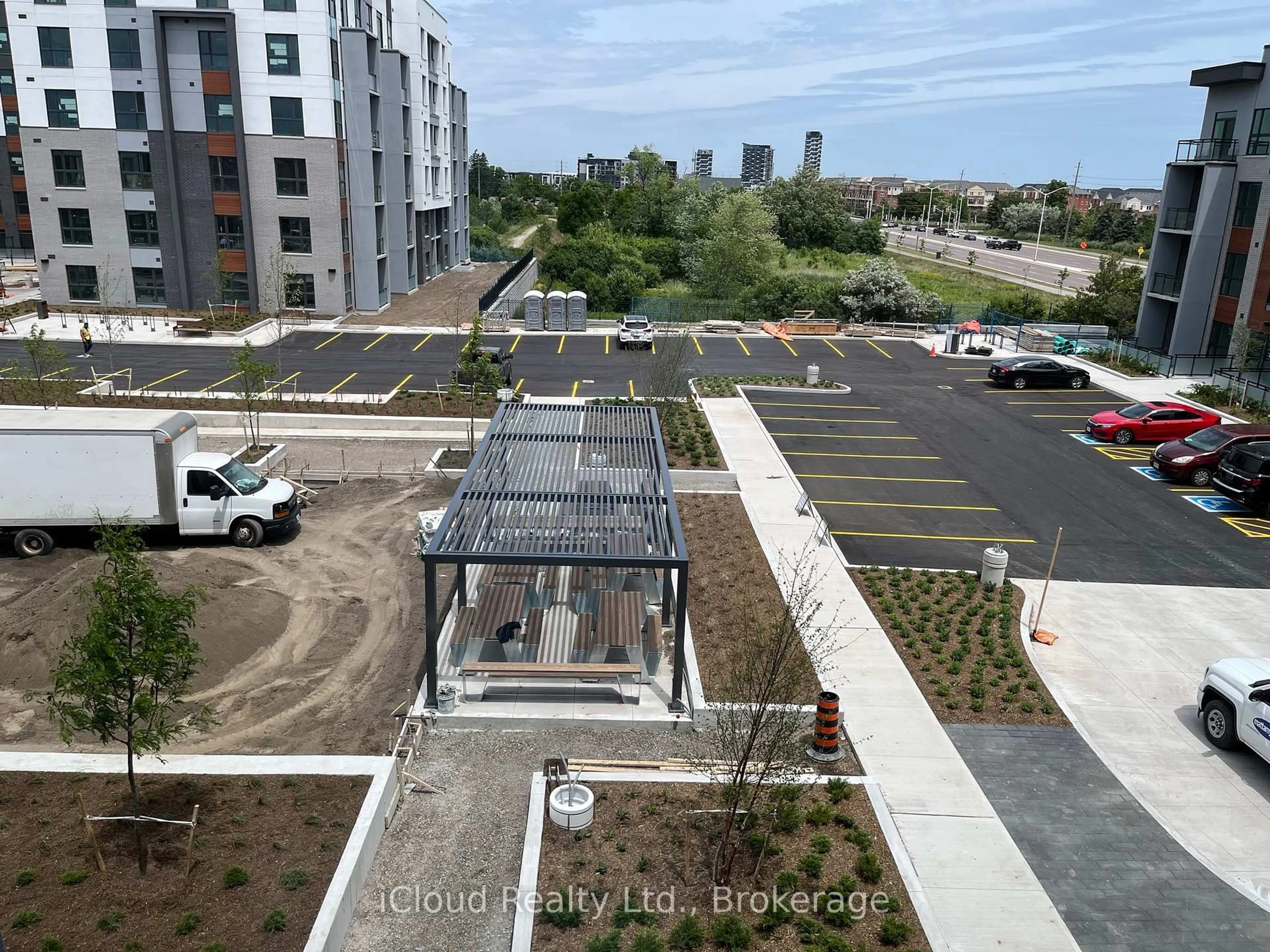 A pic from outside/outdoor area/front of a property/back of a property/a pic from drone, city buildings view from balcony for 95 Dundas St #325, Oakville Ontario L6M 5N4