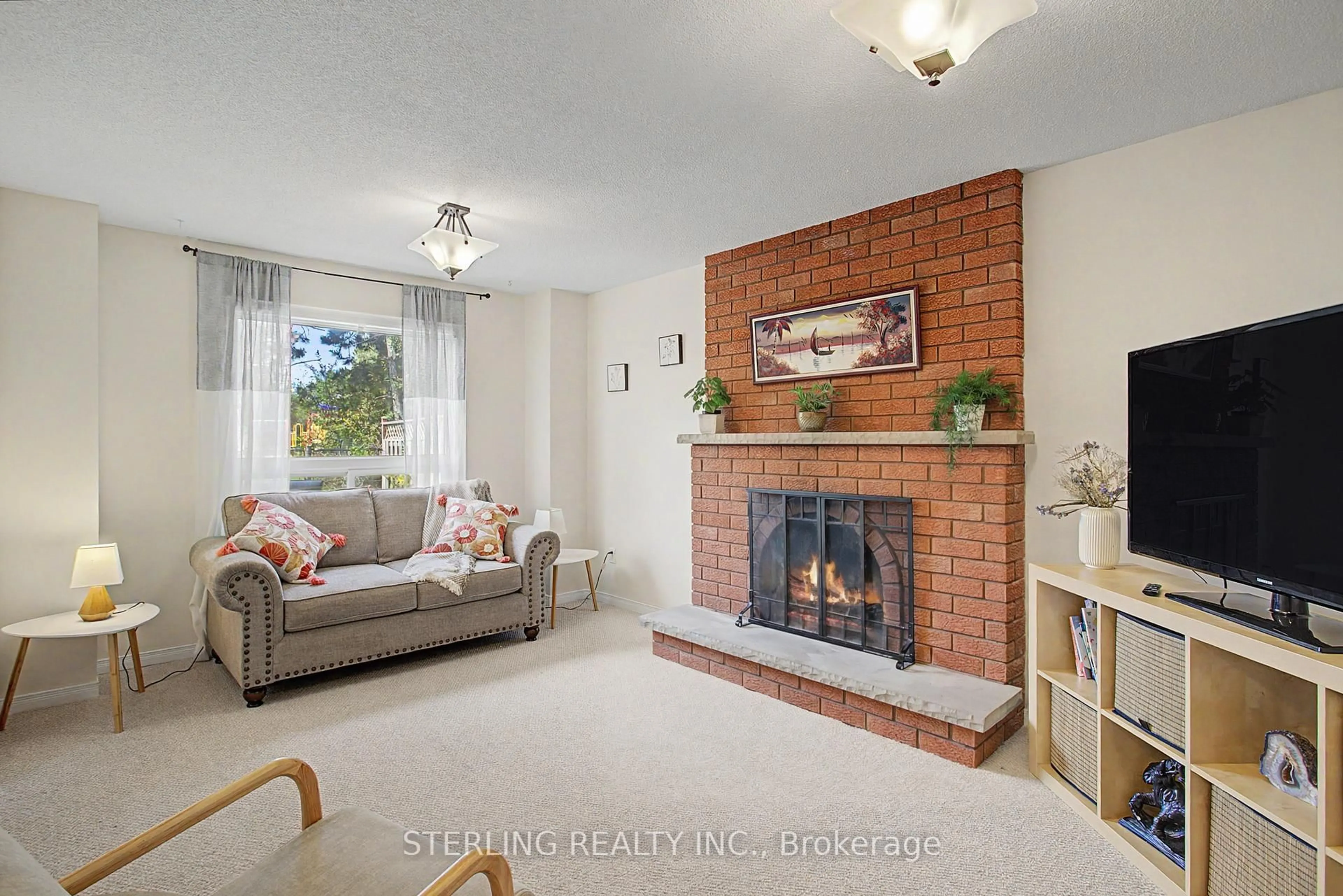 Living room with furniture, ceramic/tile floor for 72 Sunforest Dr, Brampton Ontario L6Z 3Z5