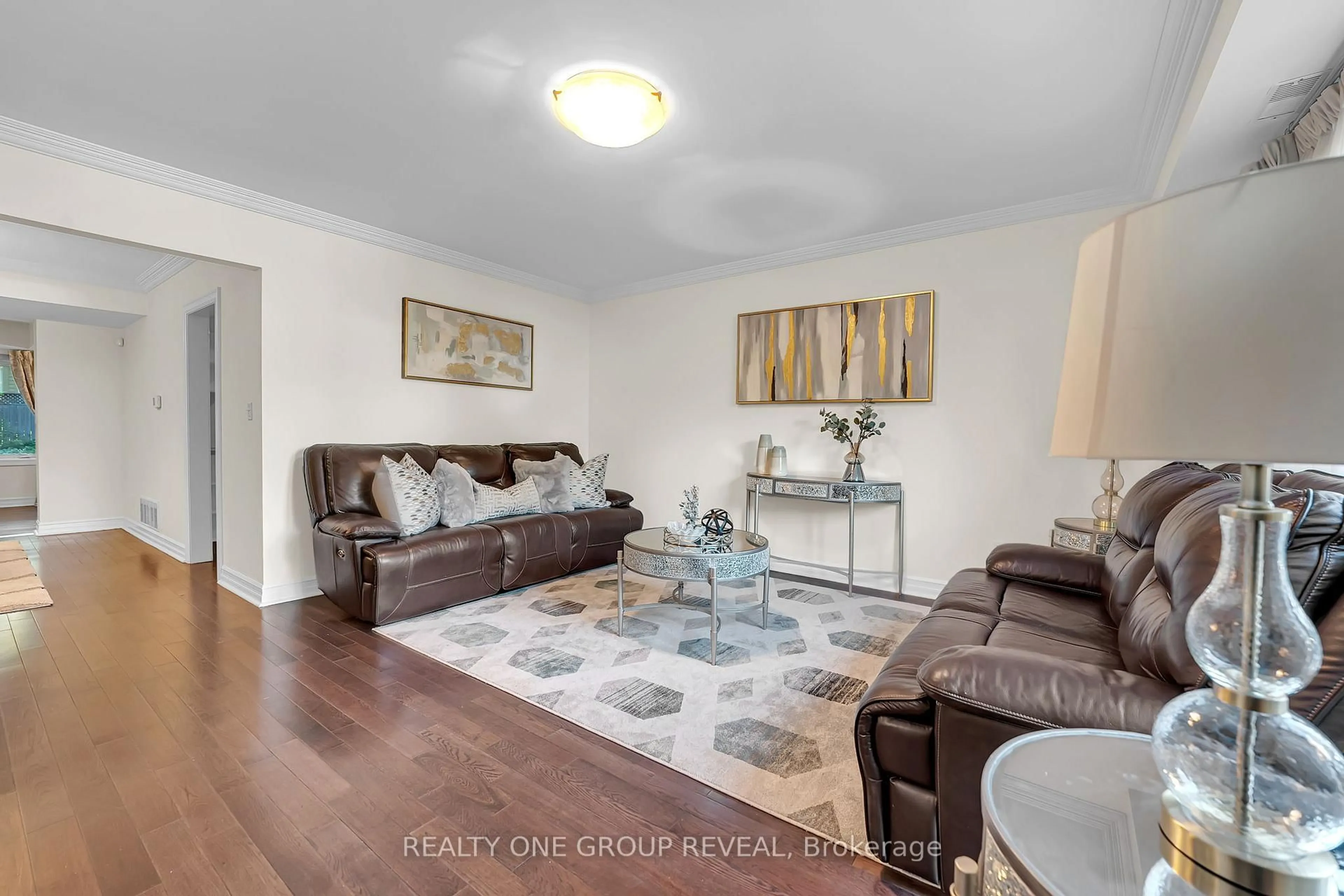 Living room with furniture, wood/laminate floor for 1490 Islington Ave, Toronto Ontario M9A 3L5