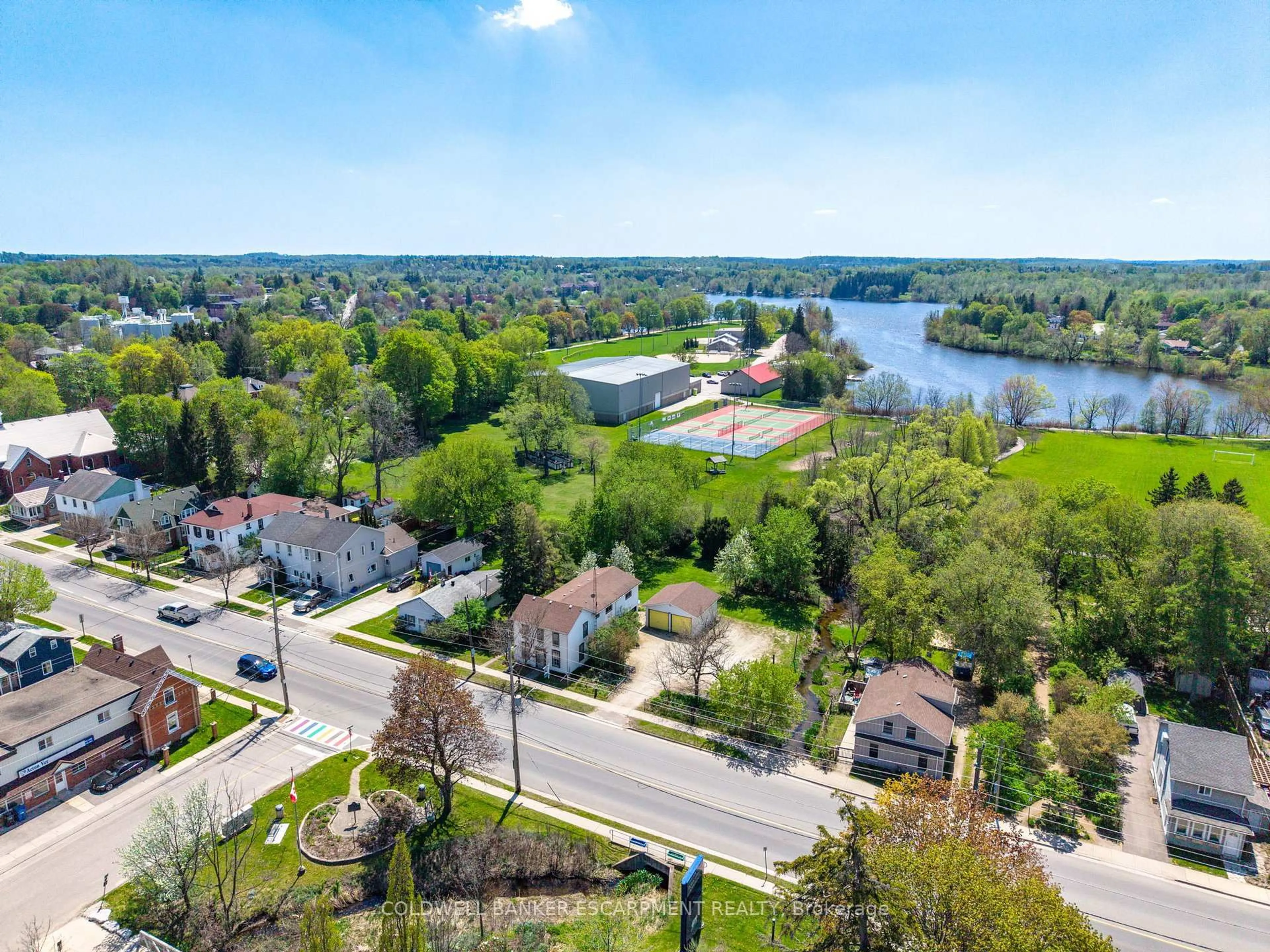 A pic from outside/outdoor area/front of a property/back of a property/a pic from drone, water/lake/river/ocean view for 76 Main St, Halton Hills Ontario L7J 1W2