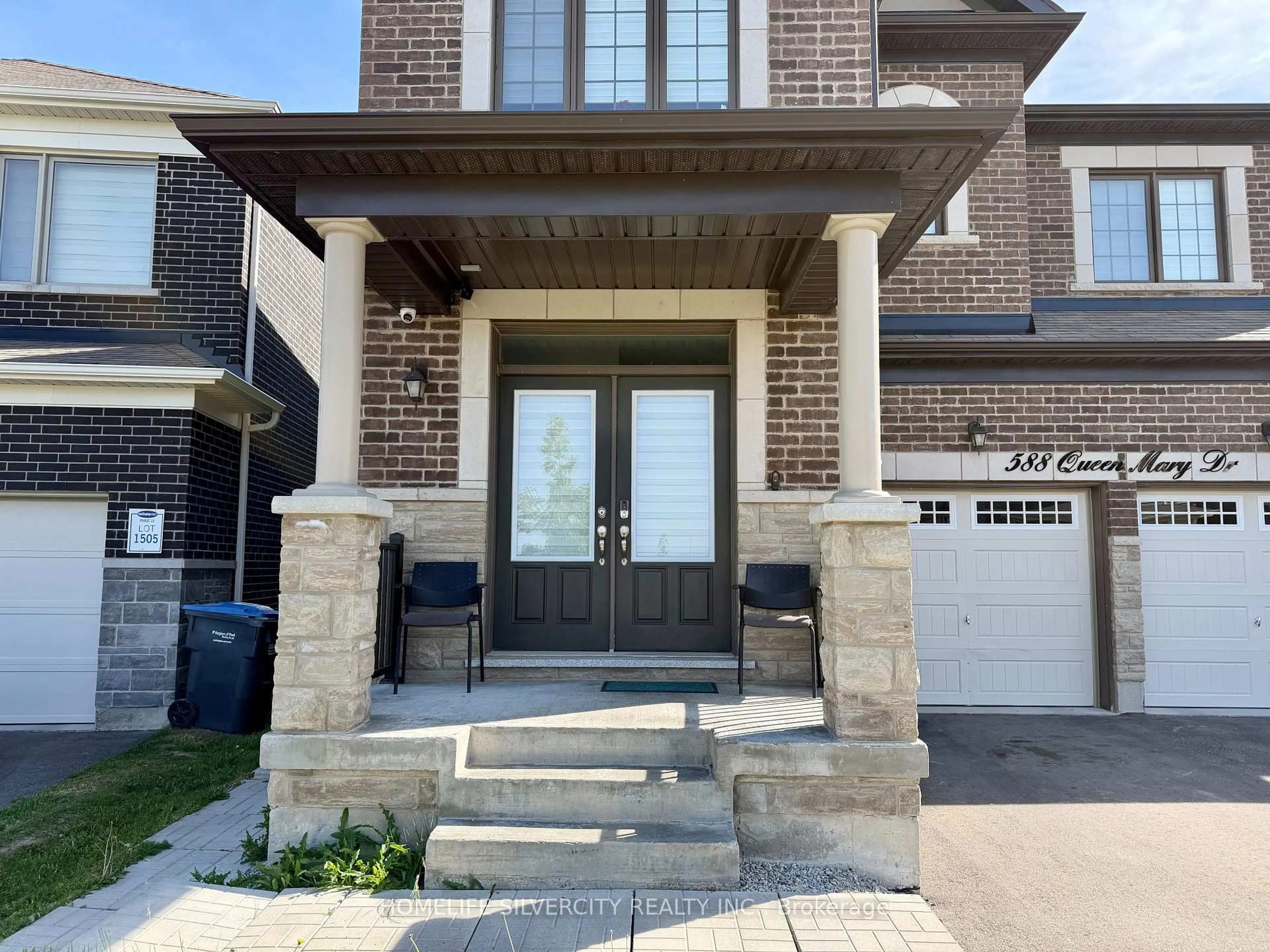 Home with brick exterior material, street for 588 Queen Mary Dr, Brampton Ontario L7A 5H5