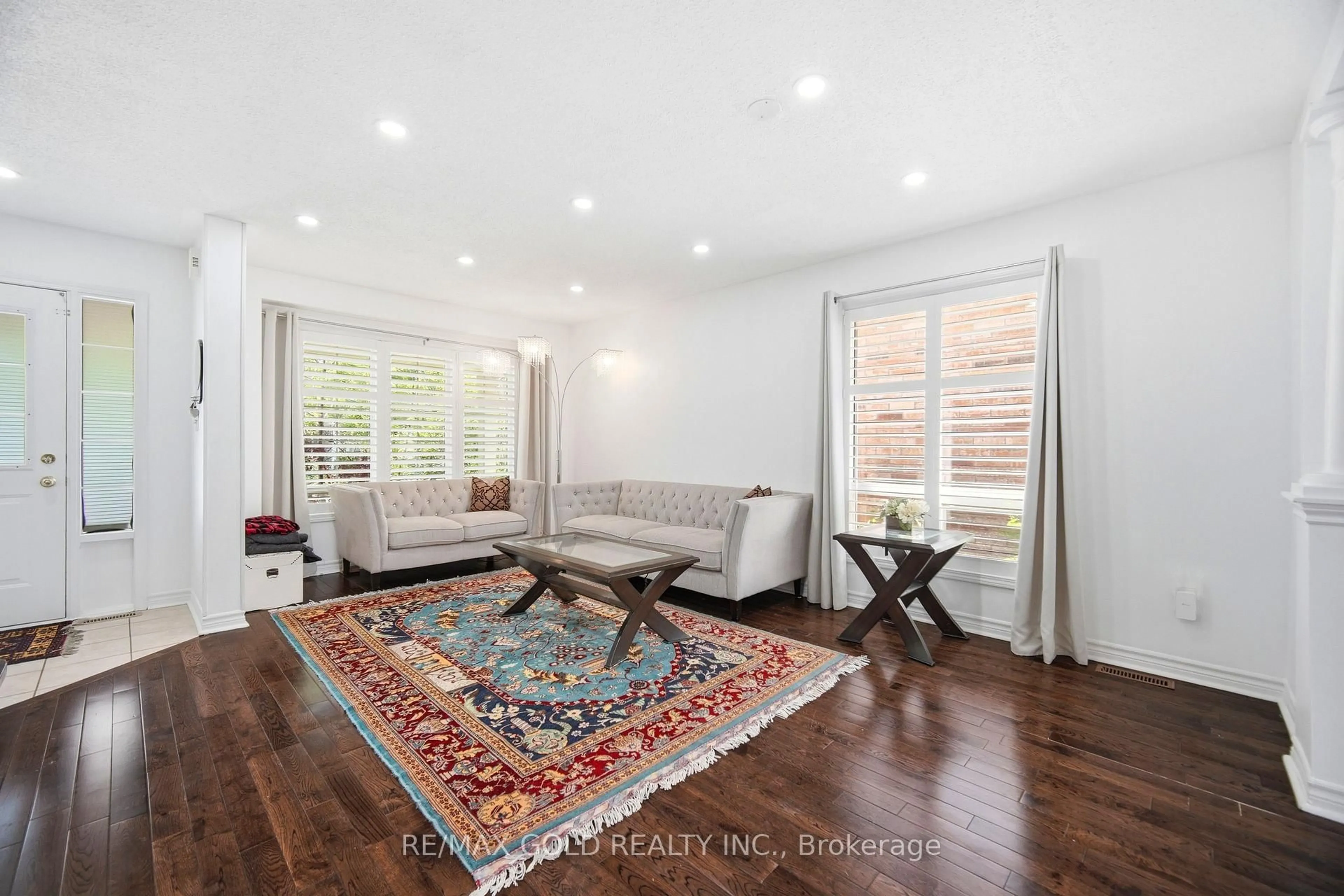 Living room with furniture, wood/laminate floor for 1523 Beaty Tr, Milton Ontario L9T 5V3