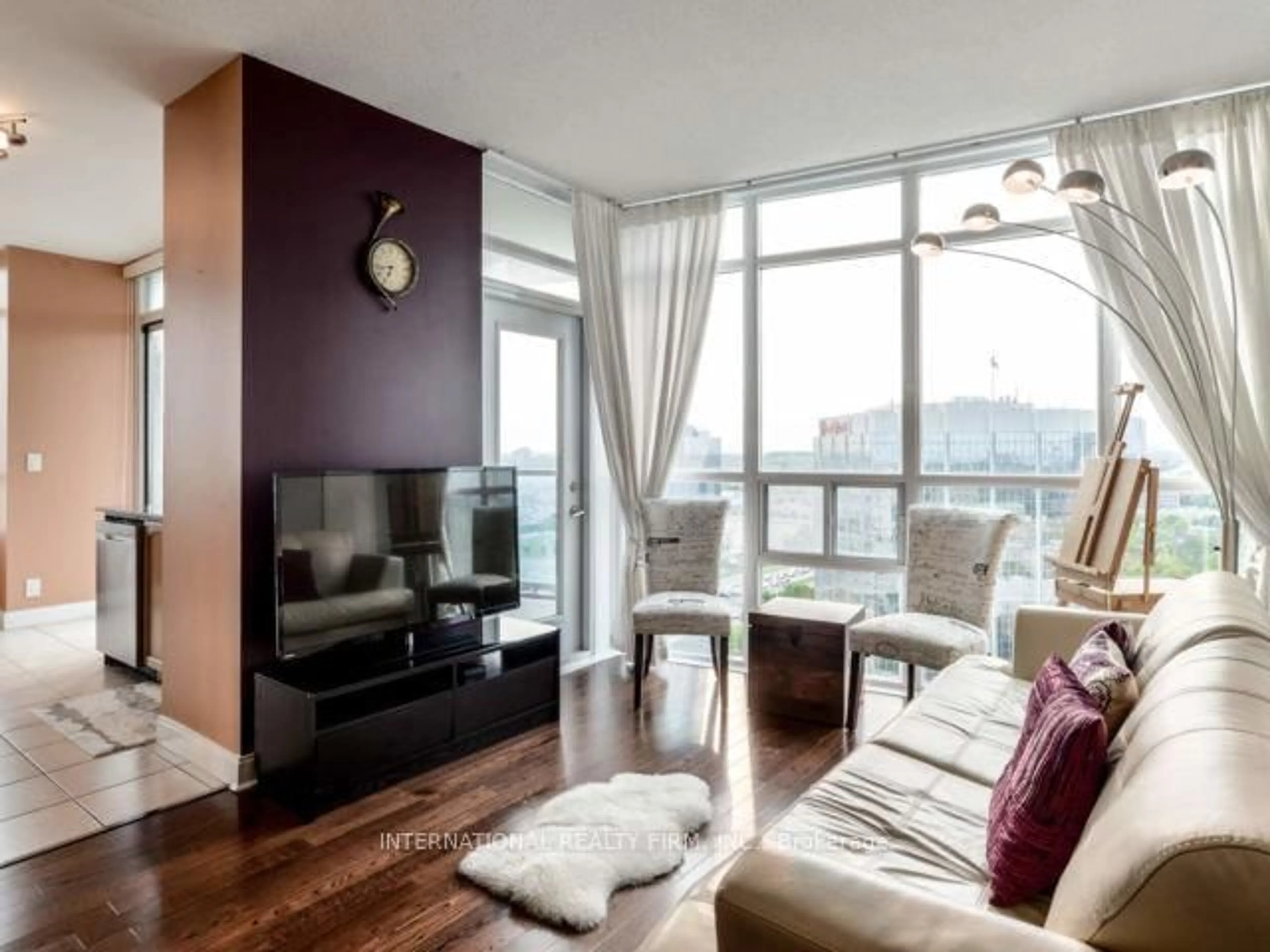 Living room with furniture, wood/laminate floor for 80 Absolute Ave #2109, Mississauga Ontario L4Z 0A5
