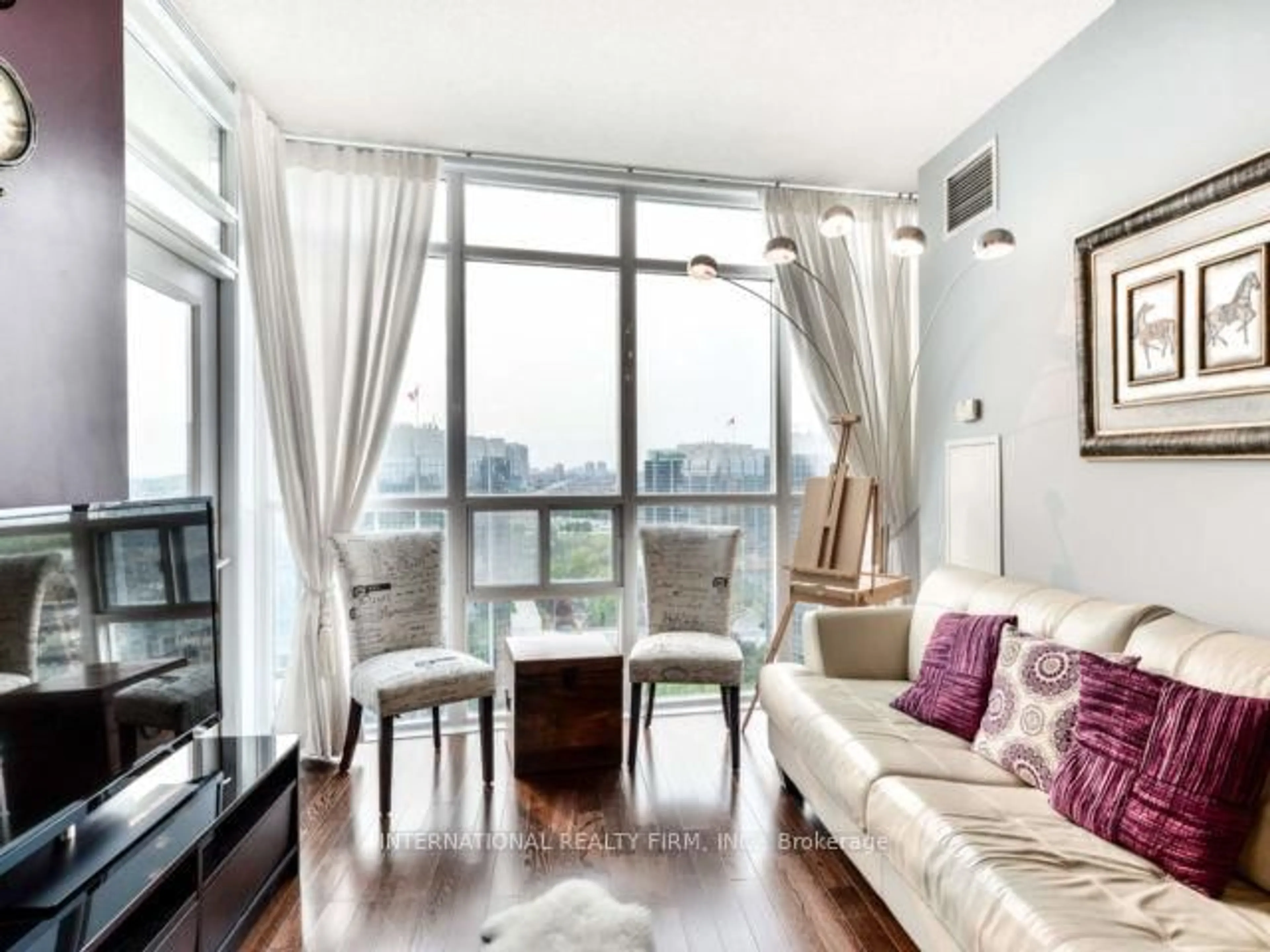 Living room with furniture, wood/laminate floor for 80 Absolute Ave #2109, Mississauga Ontario L4Z 0A5