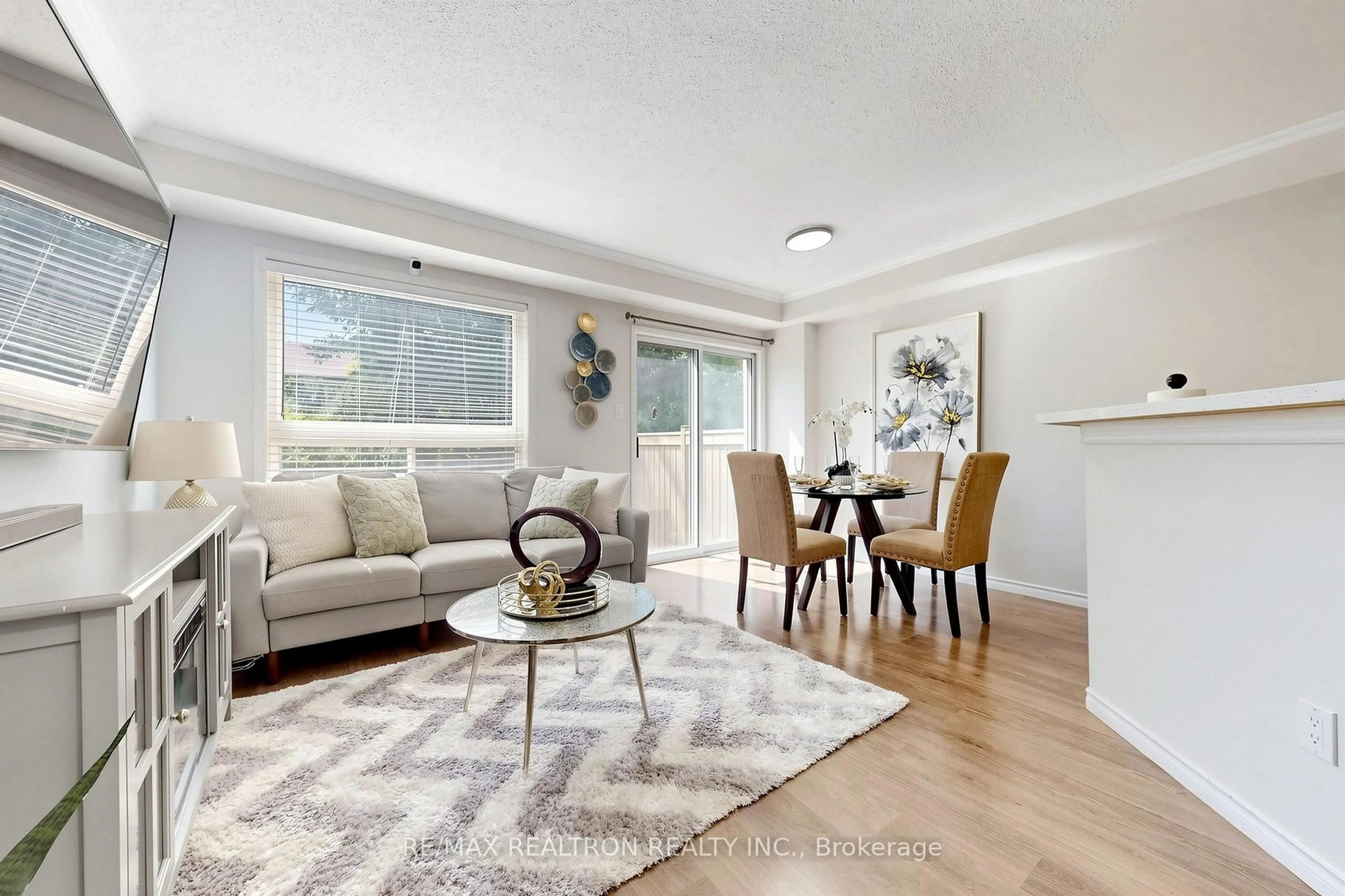 Living room with furniture, wood/laminate floor for 4600 Kimbermount Ave #63, Mississauga Ontario L5M 6Z6