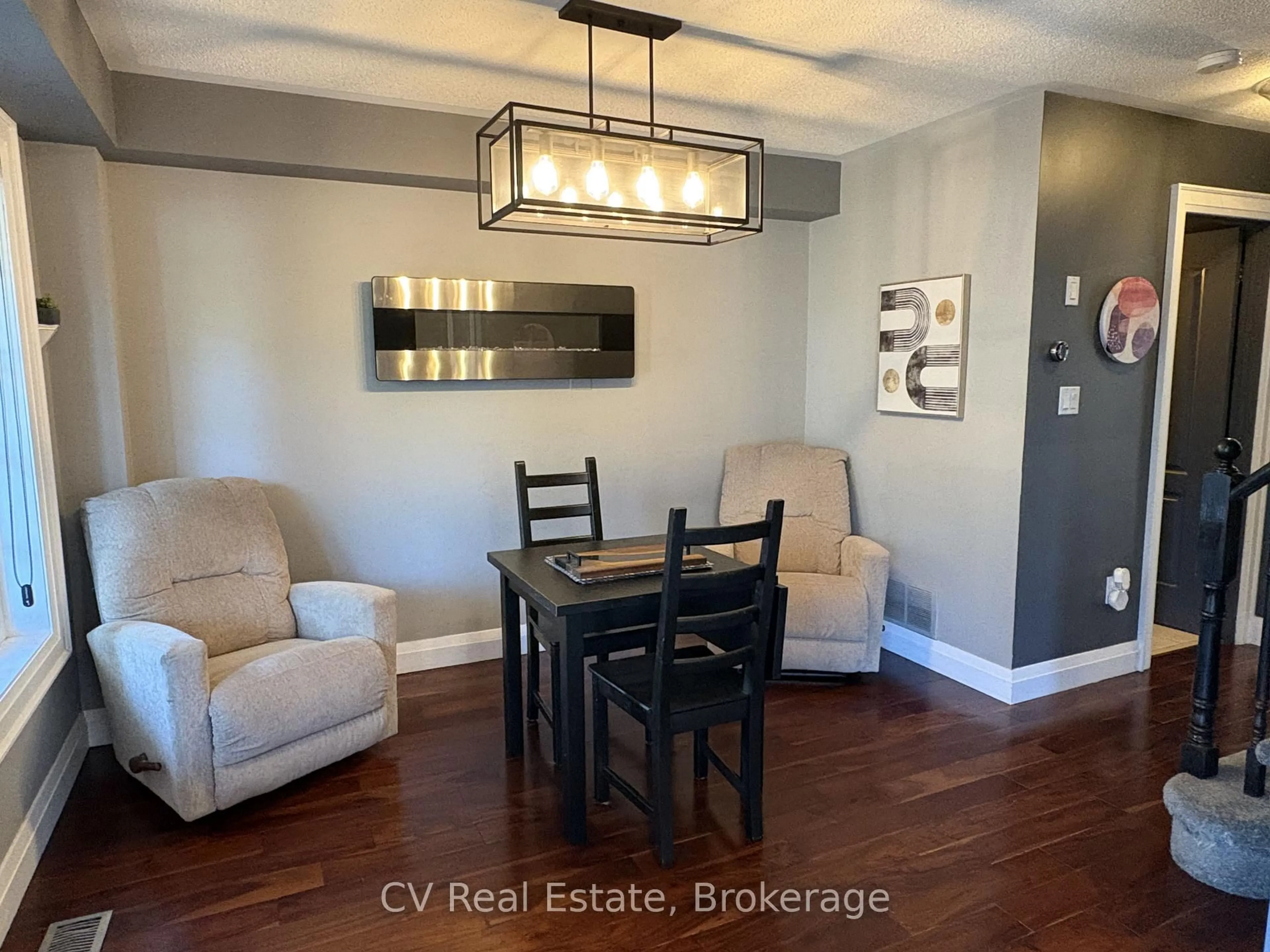 Living room with furniture, wood/laminate floor for 2396 Emerson Dr, Burlington Ontario L7L 7M4