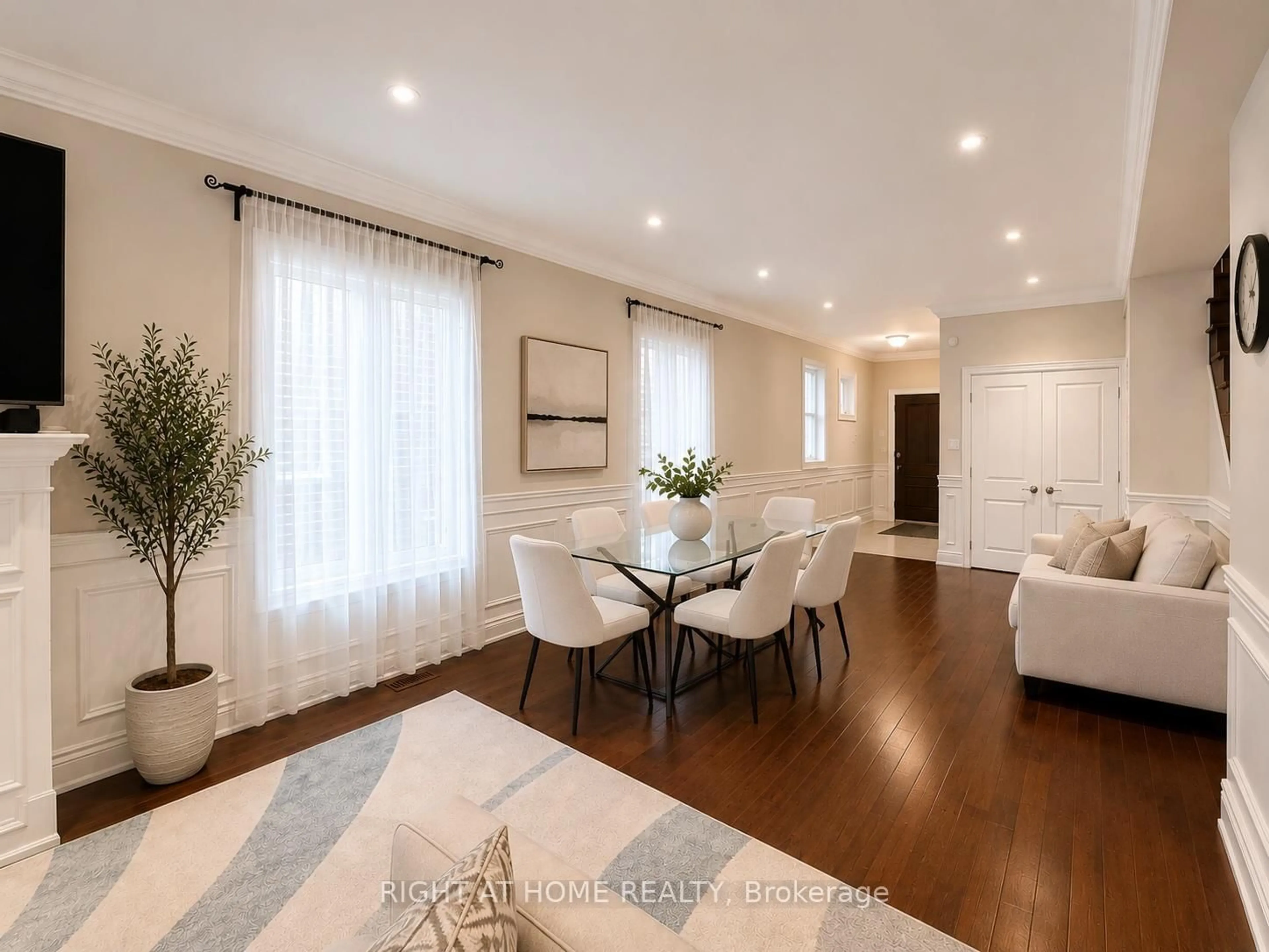 Living room with furniture, wood/laminate floor for 1049 Greaves Ave, Mississauga Ontario L5E 1W4