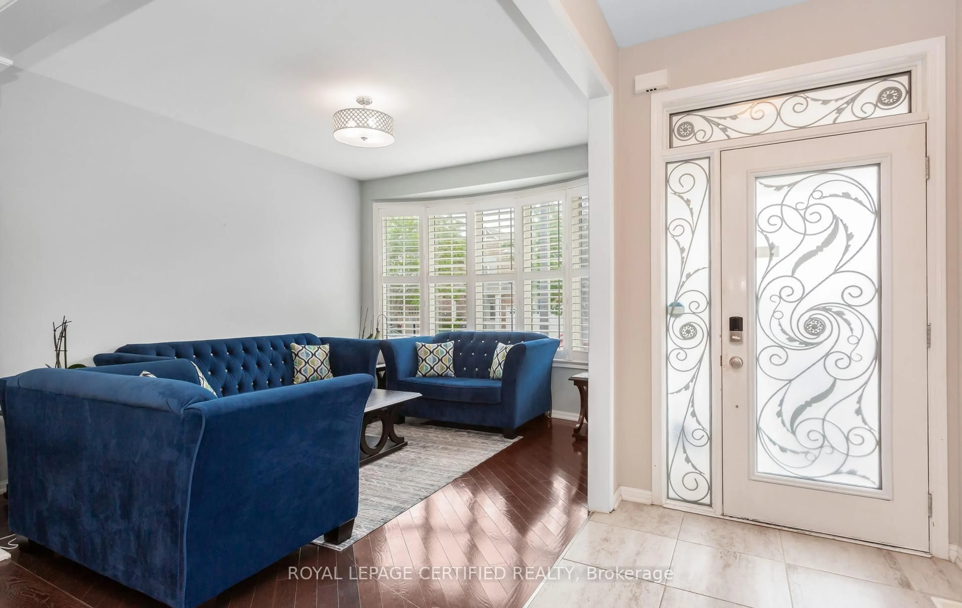 Living room with furniture, ceramic/tile floor for 311 Cochrane Terr, Milton Ontario L9T 8C8